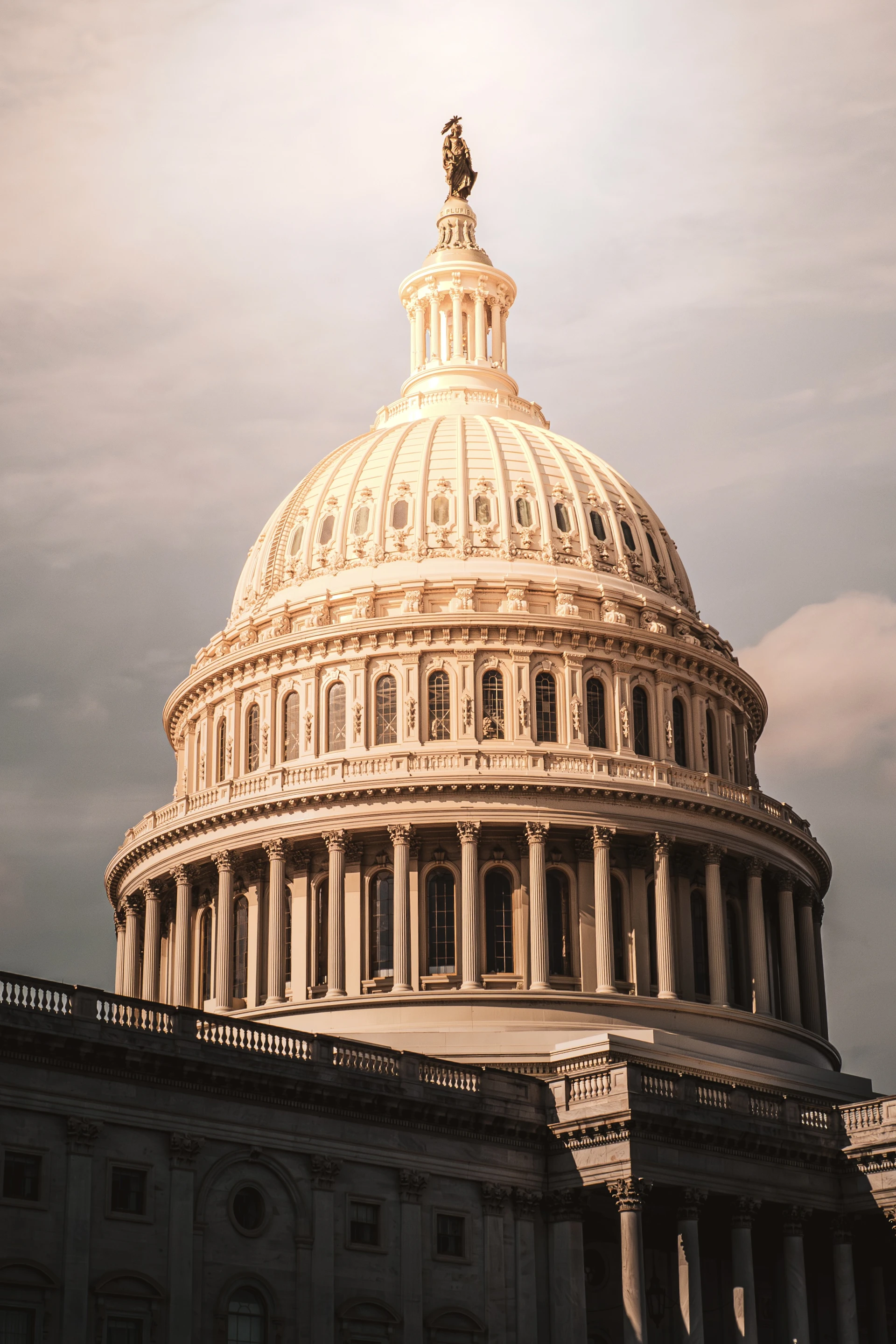 The united states capitol building dome at sunset