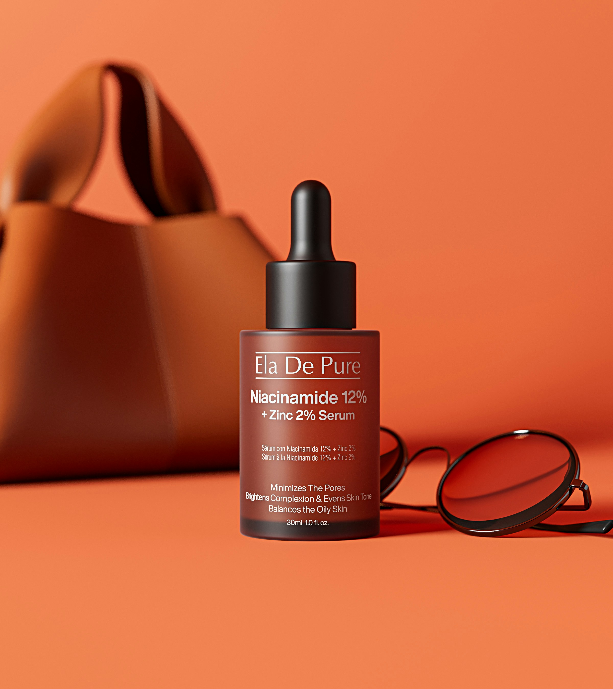 Serum bottle with sunglasses and bag on orange background