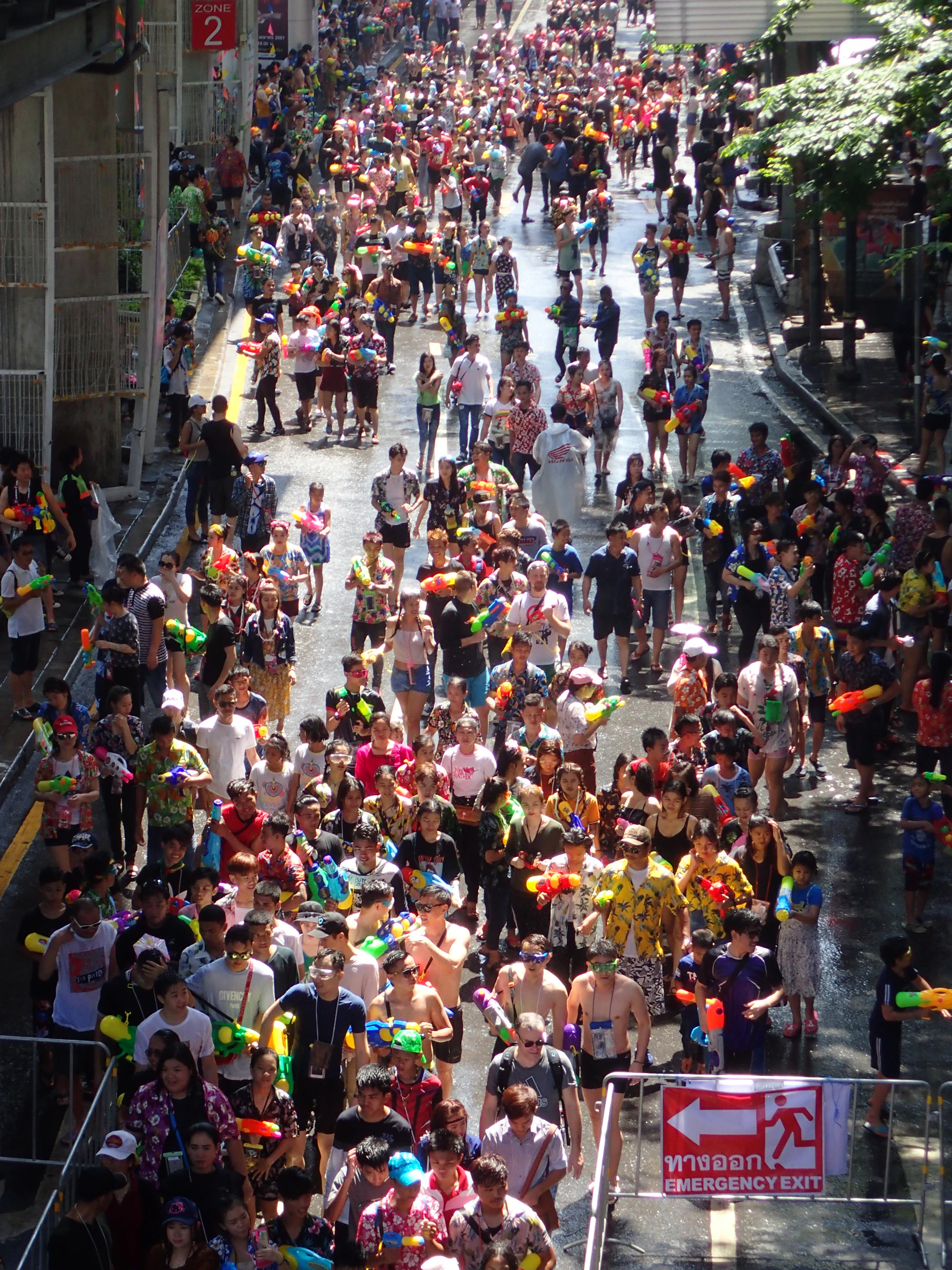 Crowd celebrating the Songkran water festival on a Bangkok street