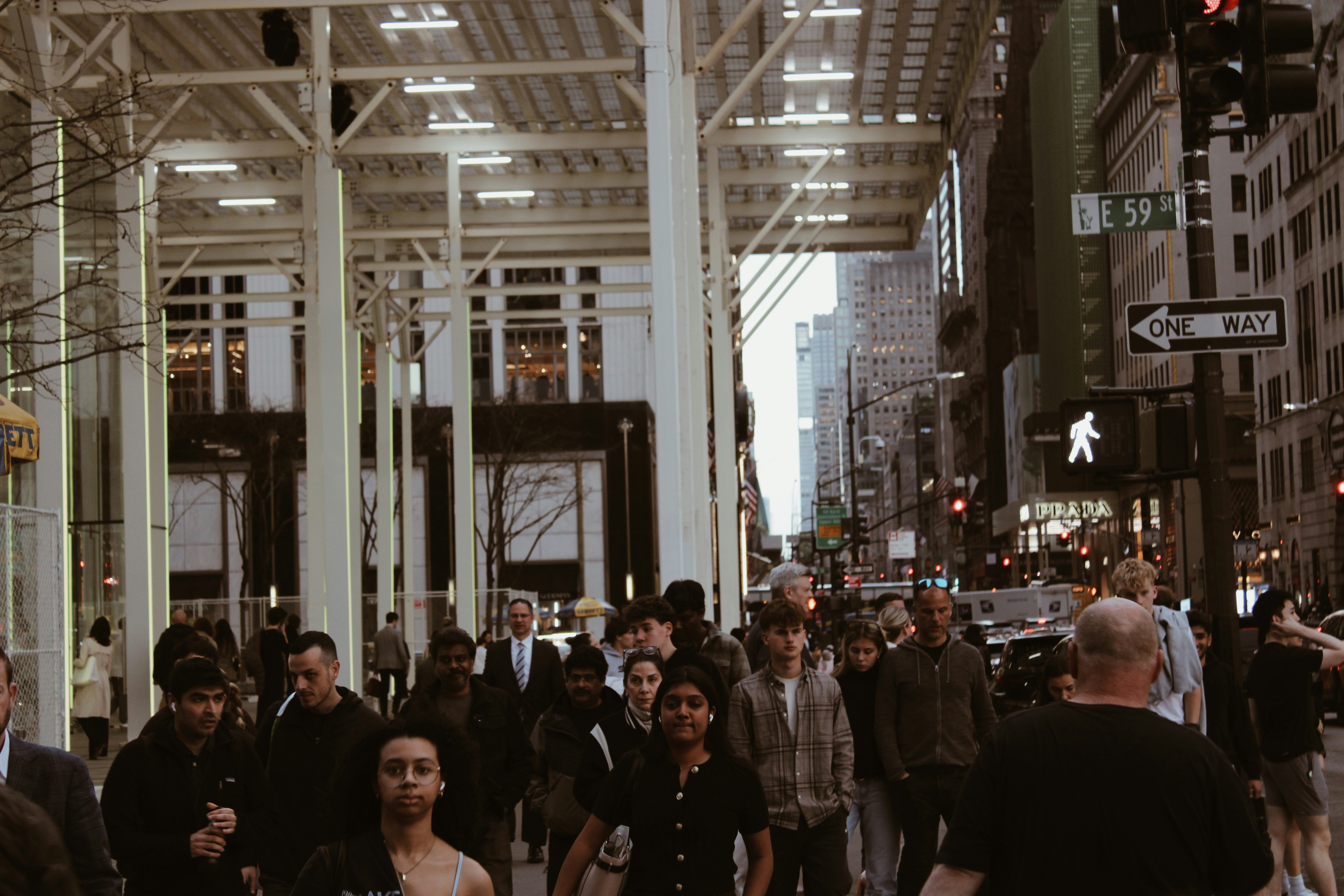 a crowd of people walking in New York City