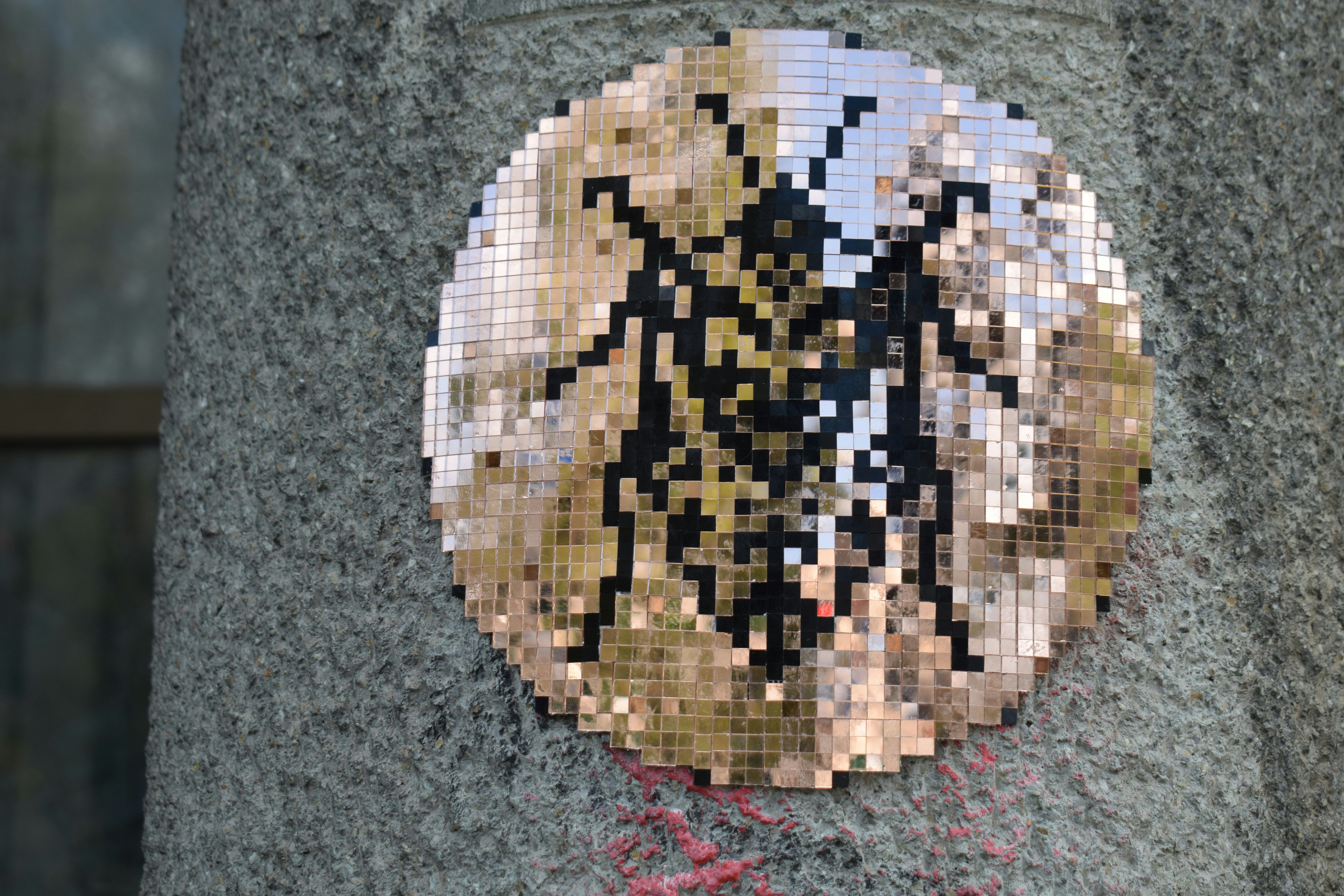 Mosaico de hormigas pixeladas sobre una superficie texturizada