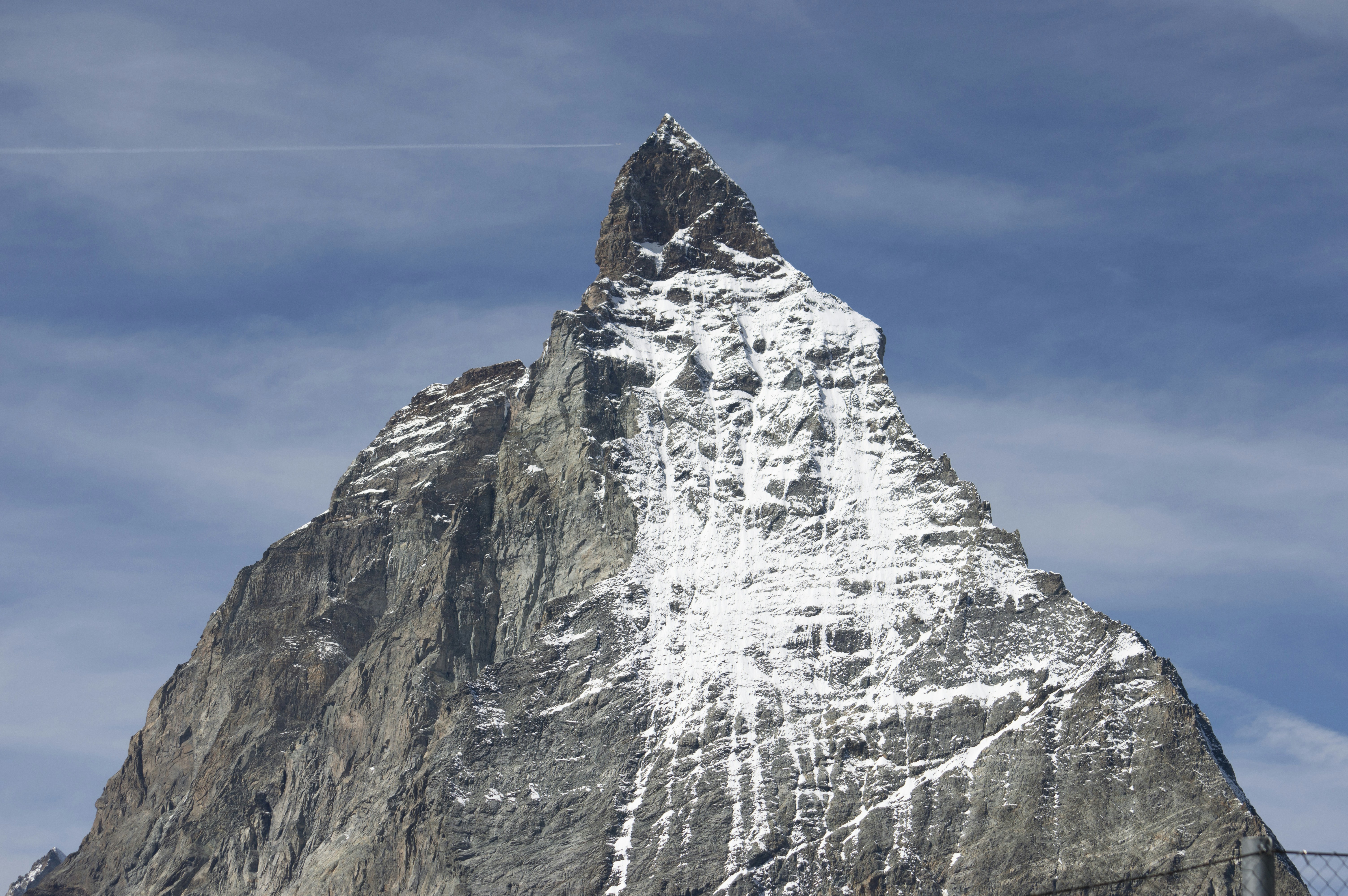 Snow-capped mountain peak against a blue sky