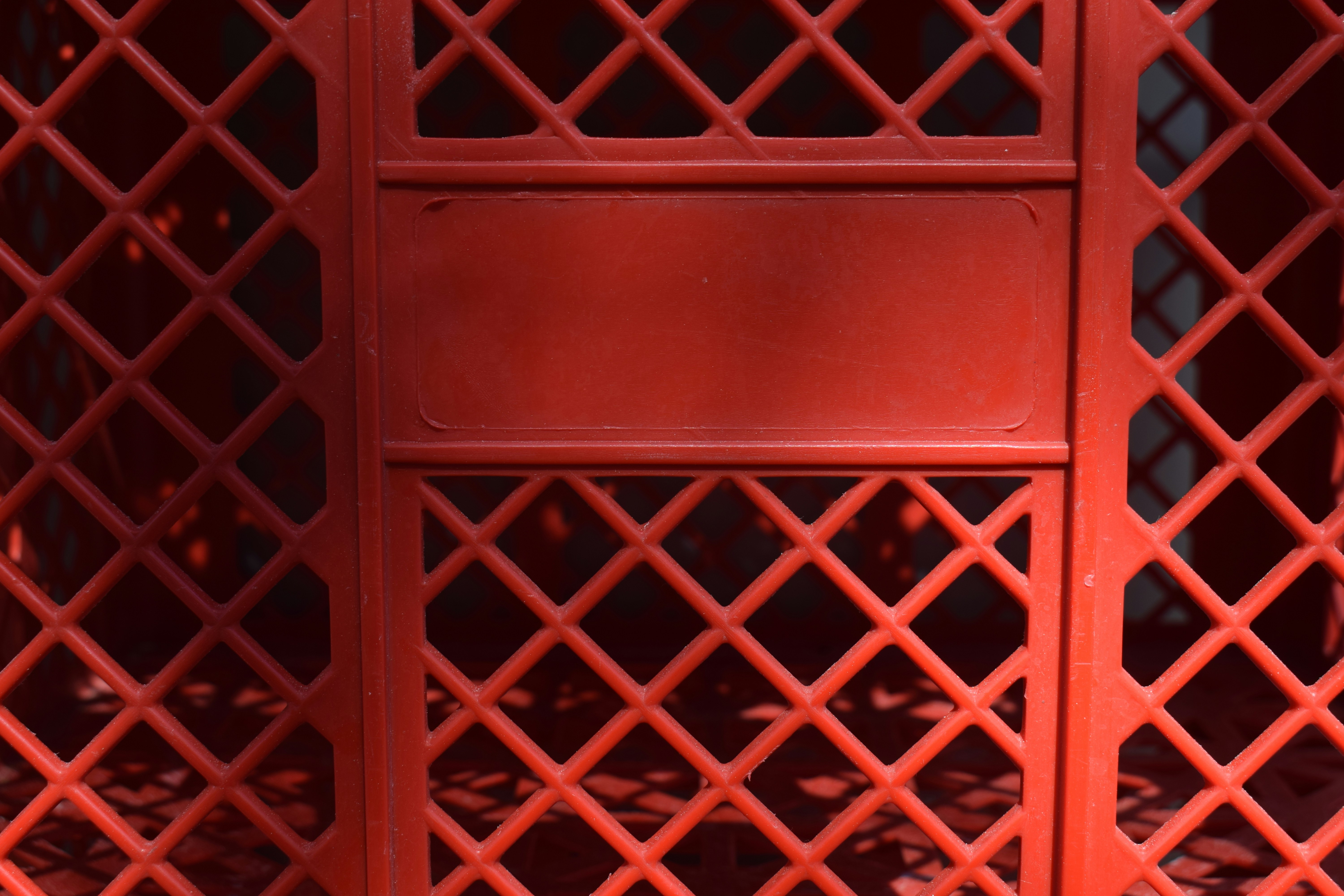 Red lattice gate with a blank sign
