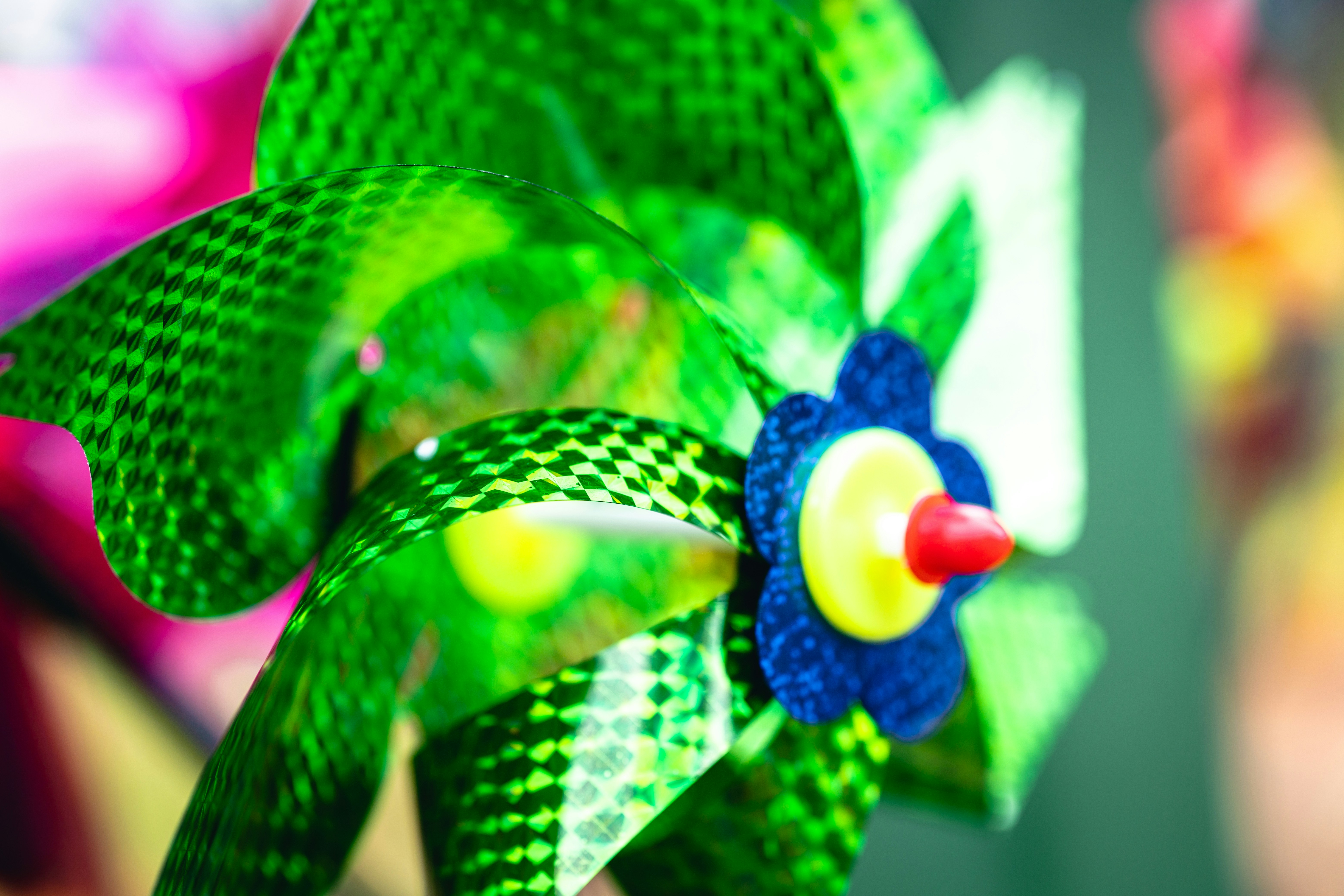 Green pinwheel with a blue flower center