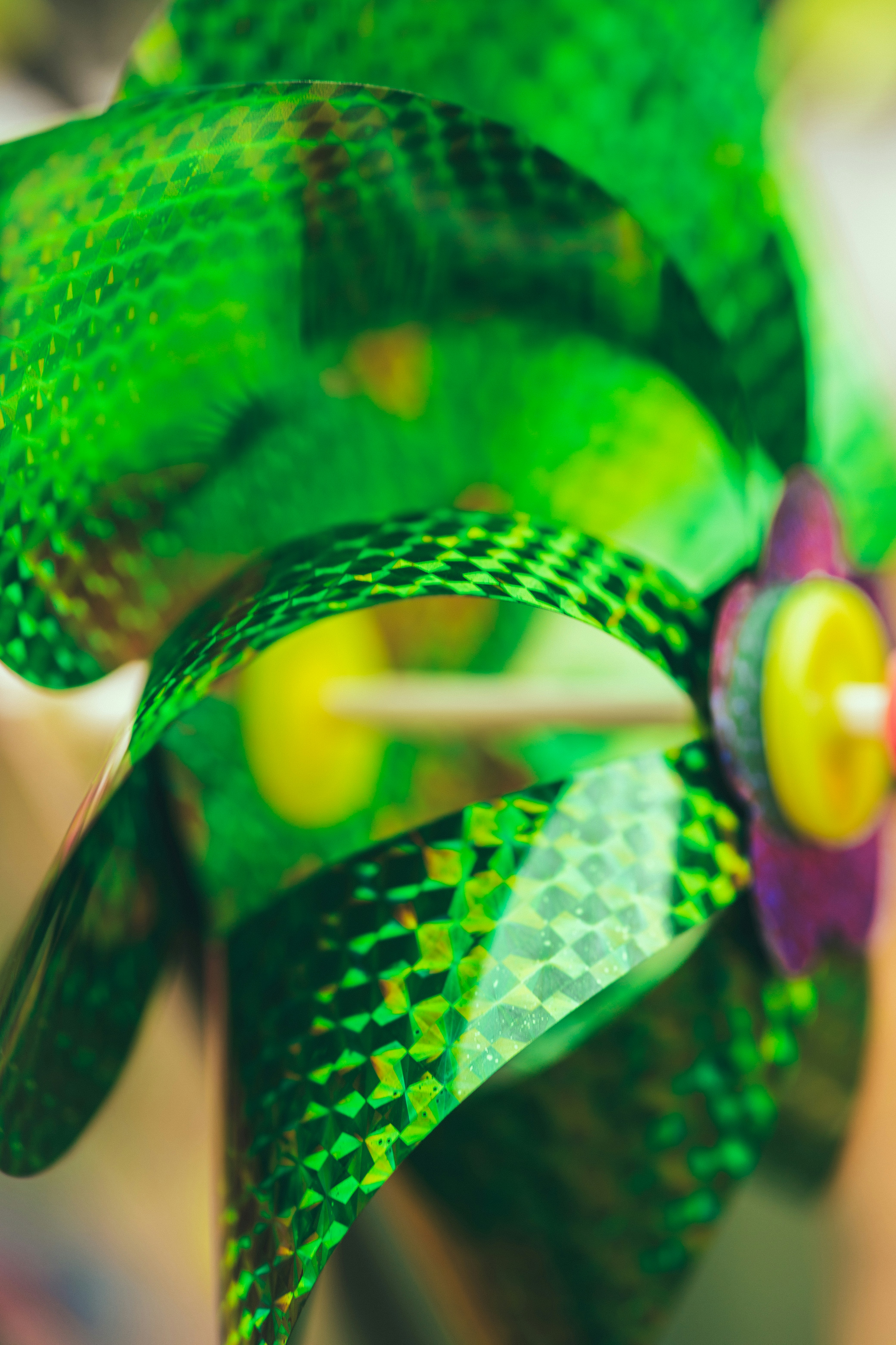 A green pinwheel with a yellow center.