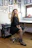 Woman with curly hair in a tattoo studio
