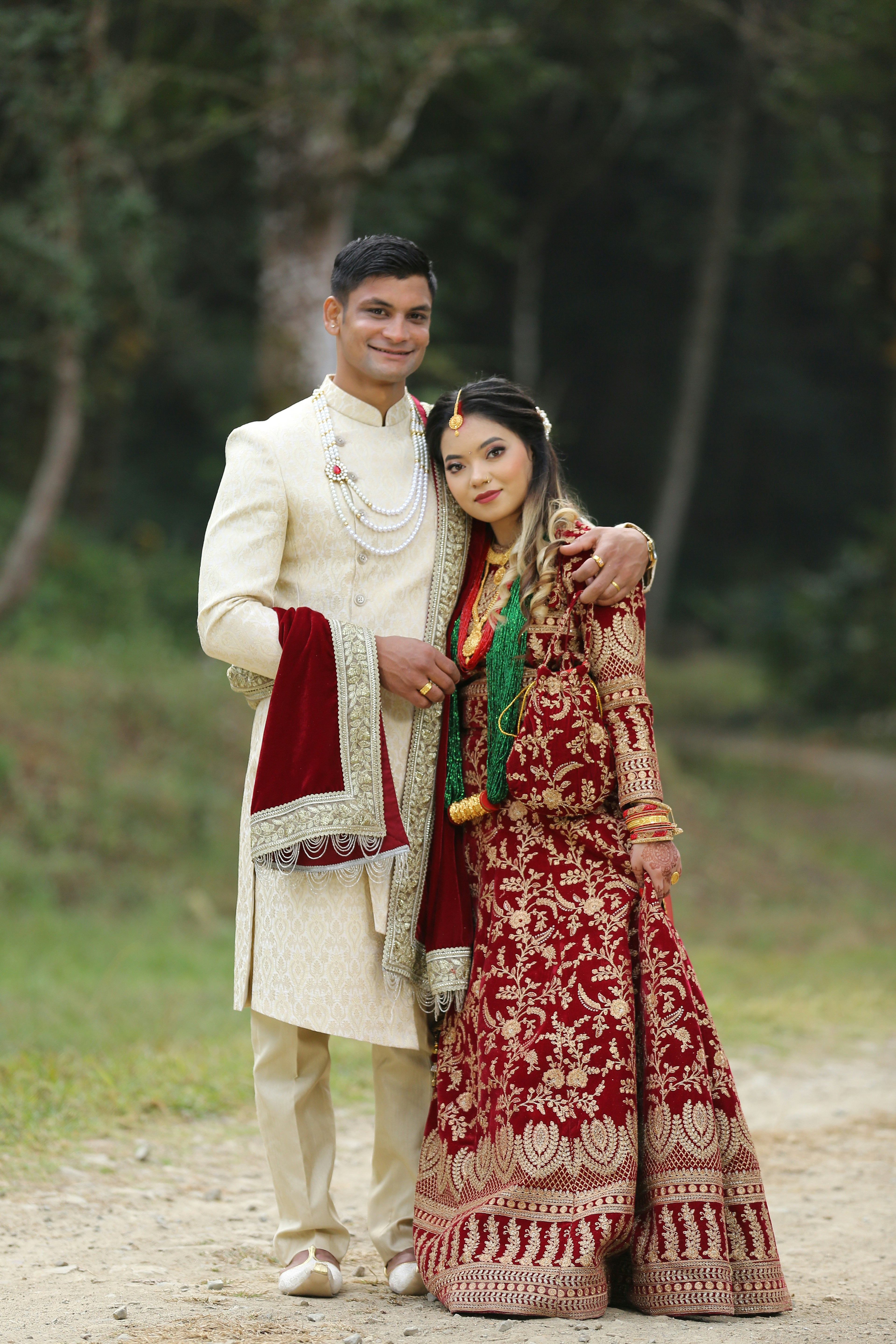 A smiling couple in traditional indian wedding attire. photo – Free ...
