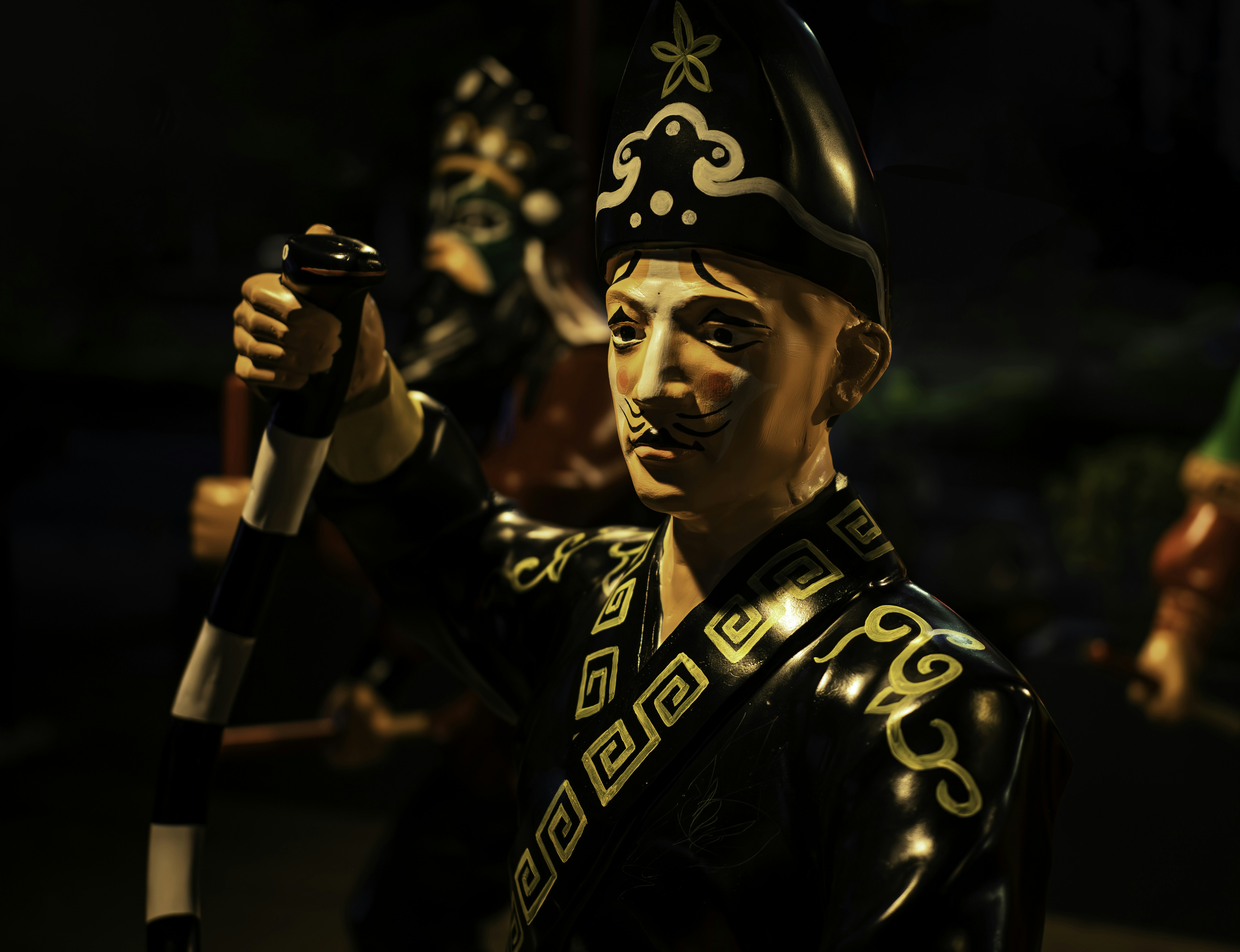 A detailed statue of a man in ornate attire