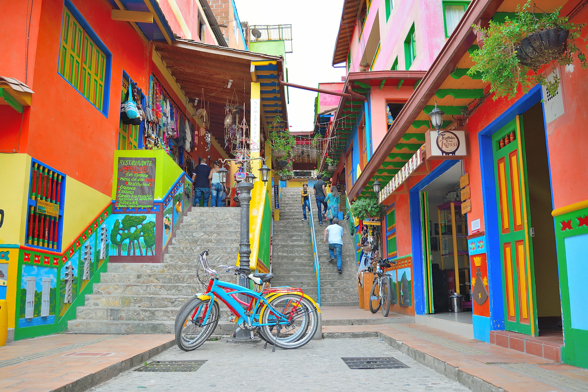 Colorful buildings line a steep staircase in a town.