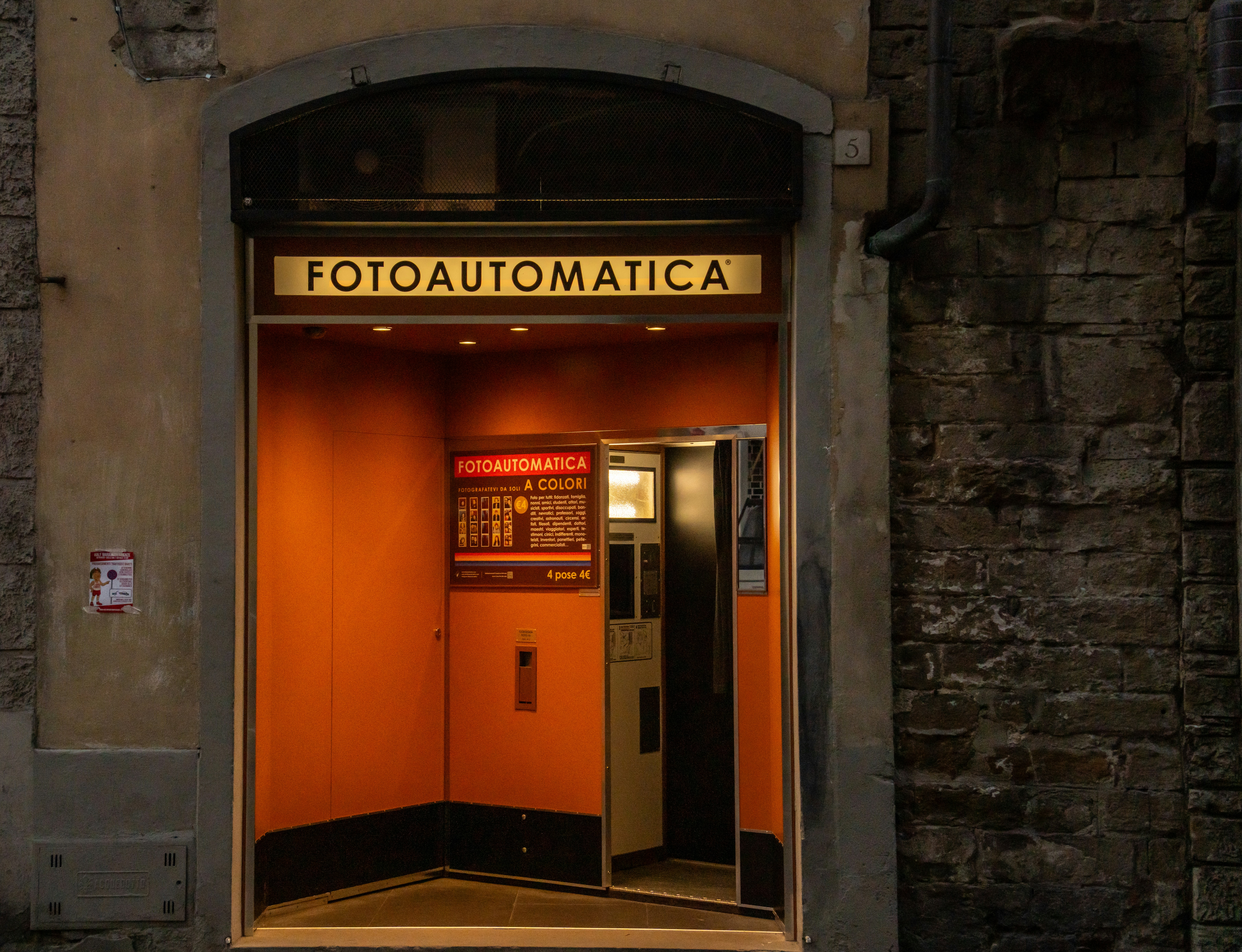 Entrance to an old photo booth at night