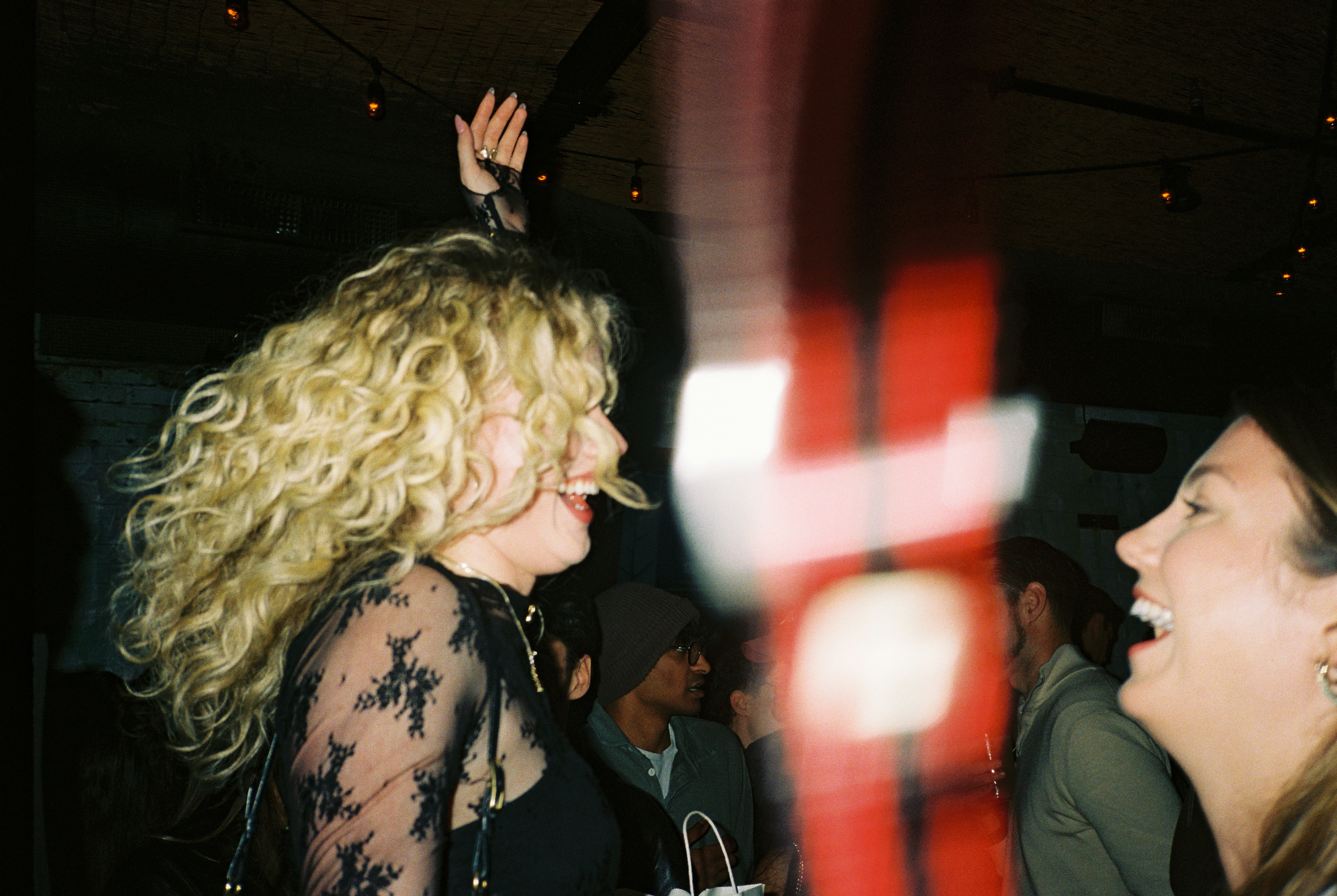 Two women laughing and enjoying a night out