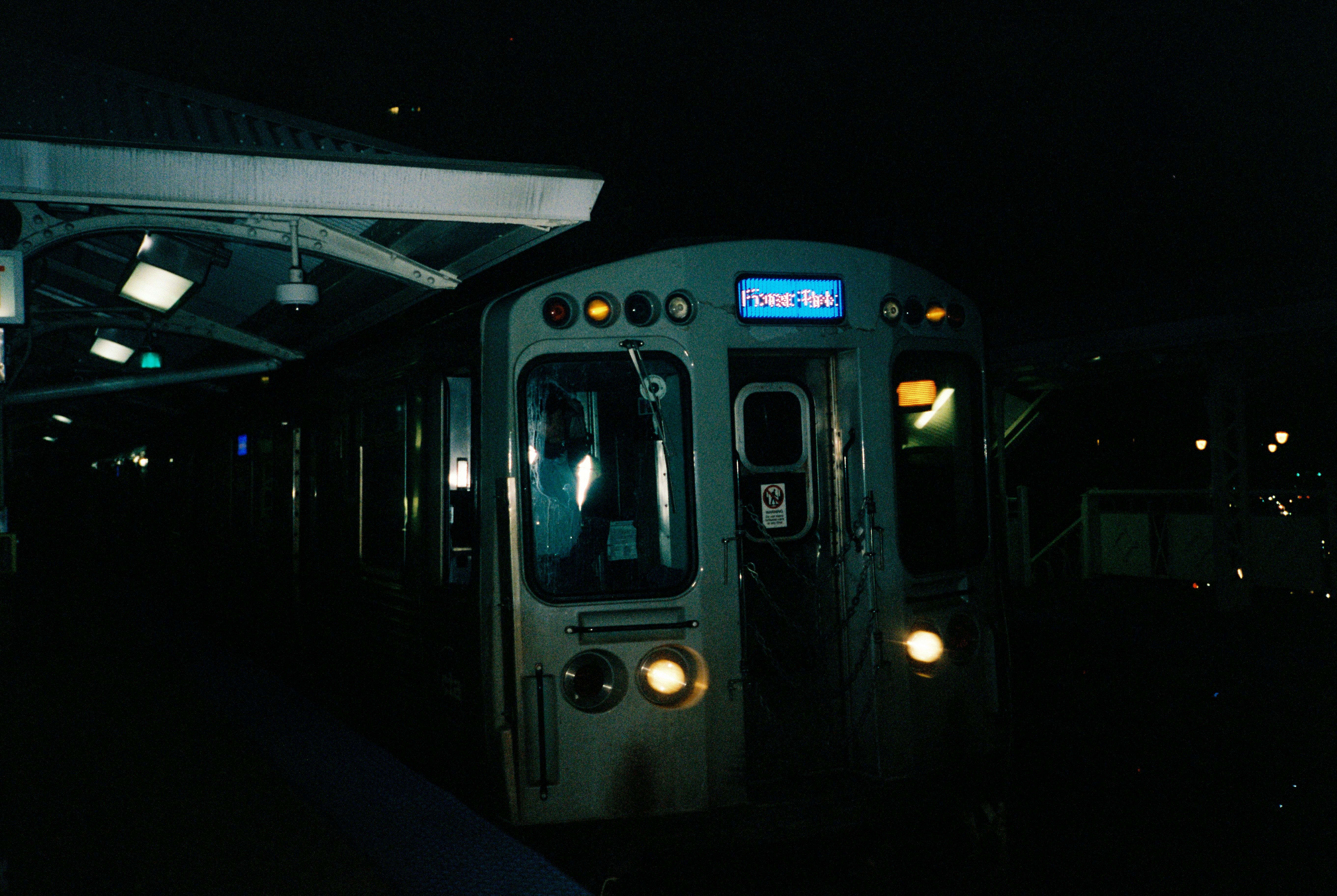 A train at a station at night.