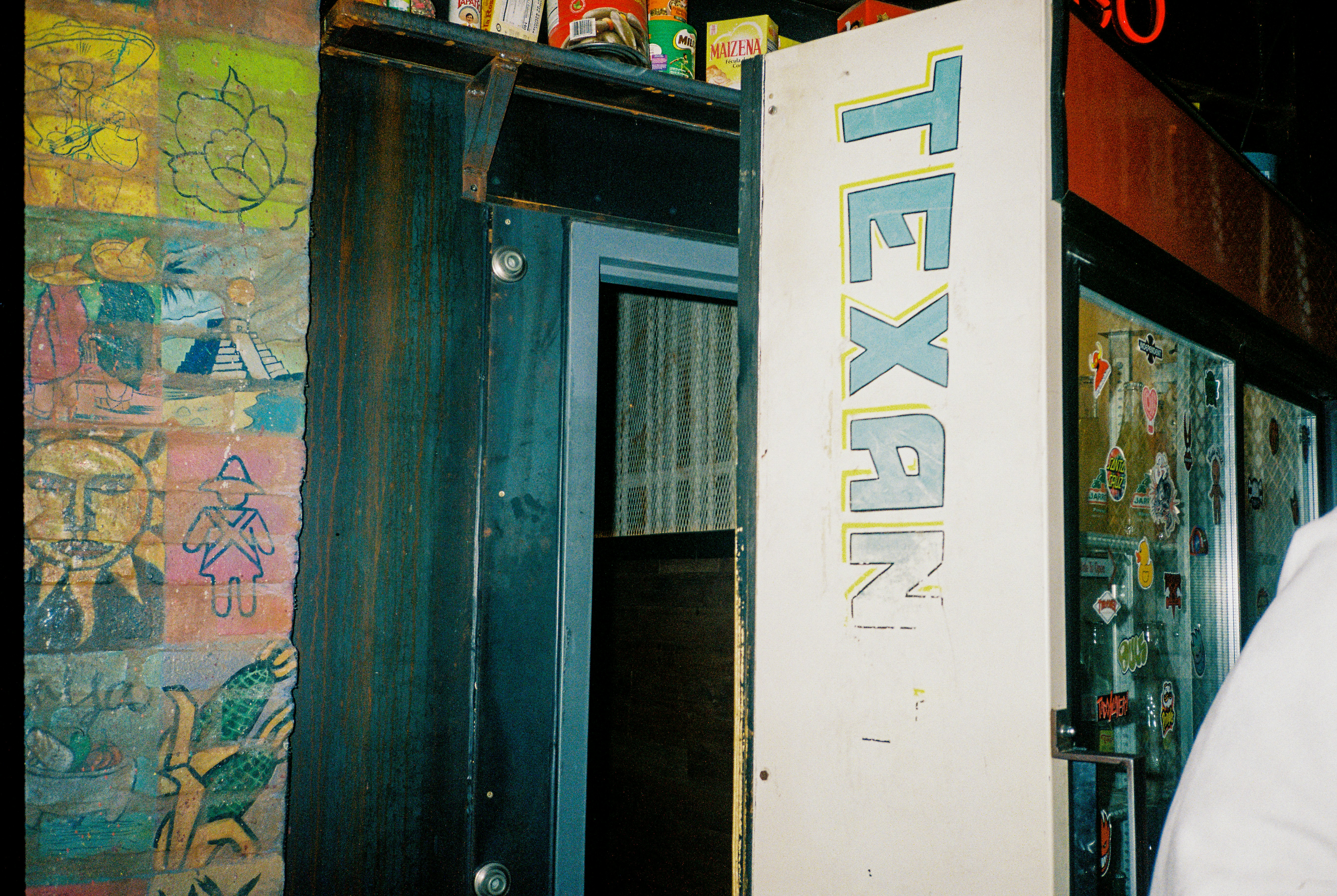 A door with "texan" written vertically on it