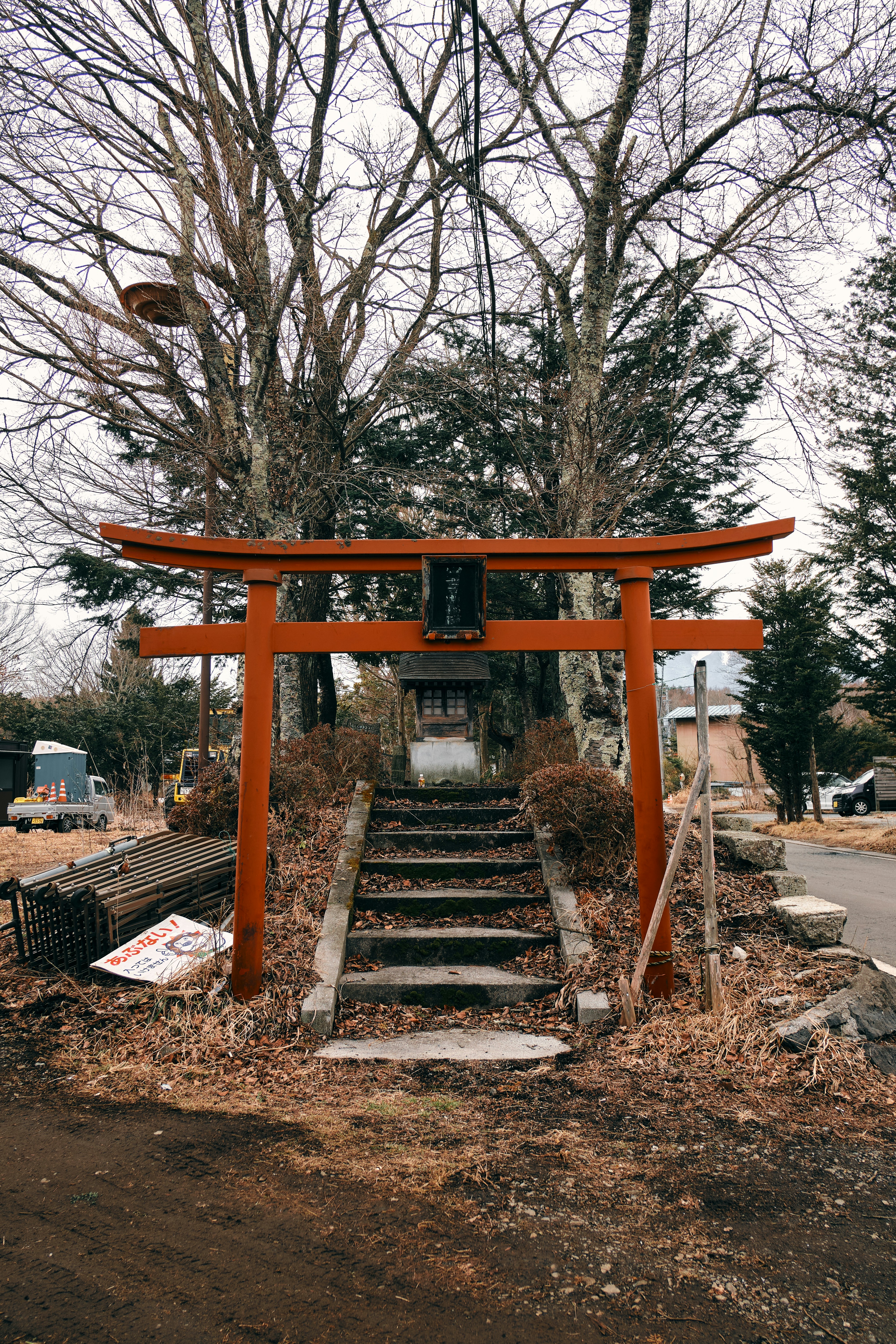 Red torii gate with stone steps leading to shrine