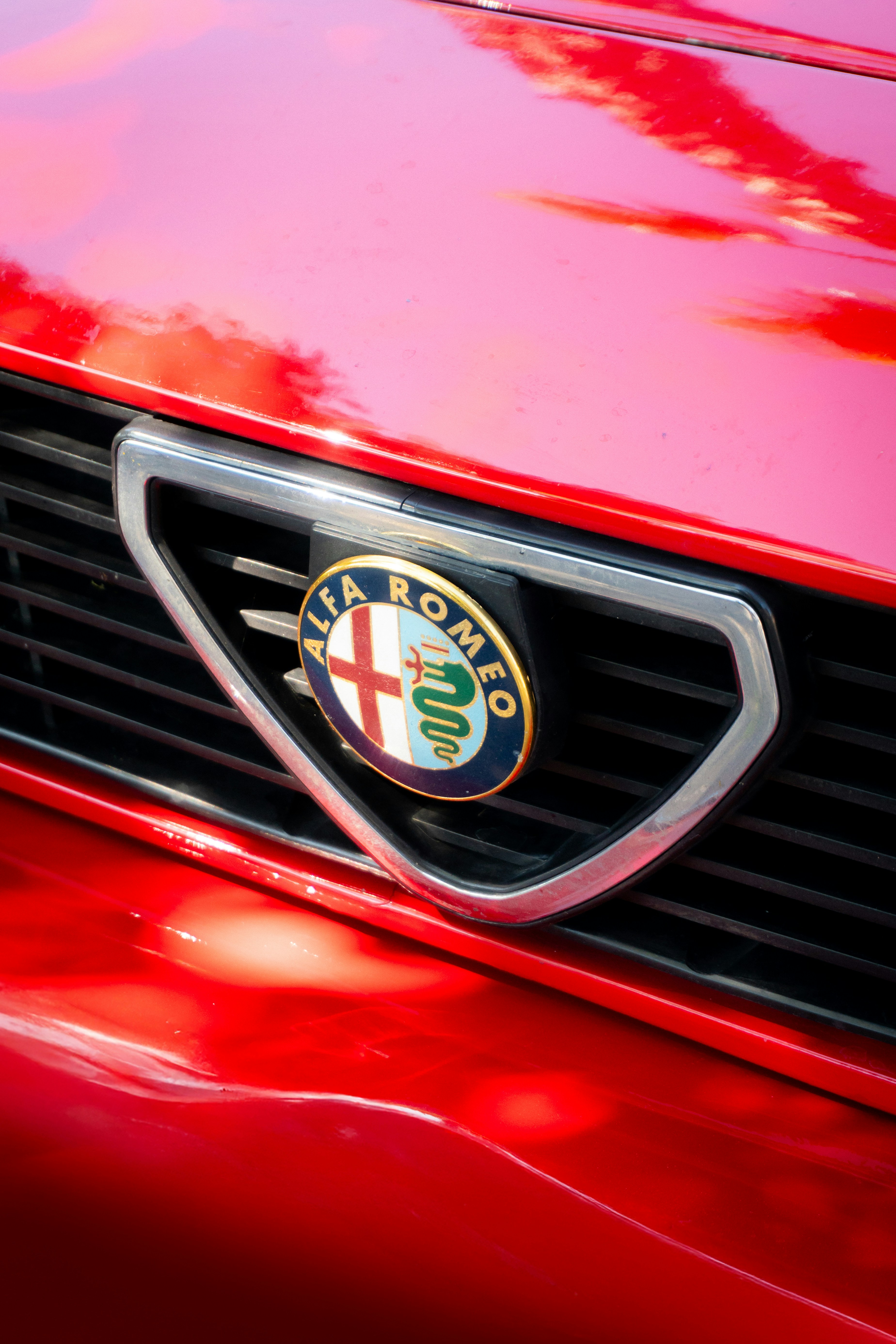 Close-up of a red alfa romeo car grille