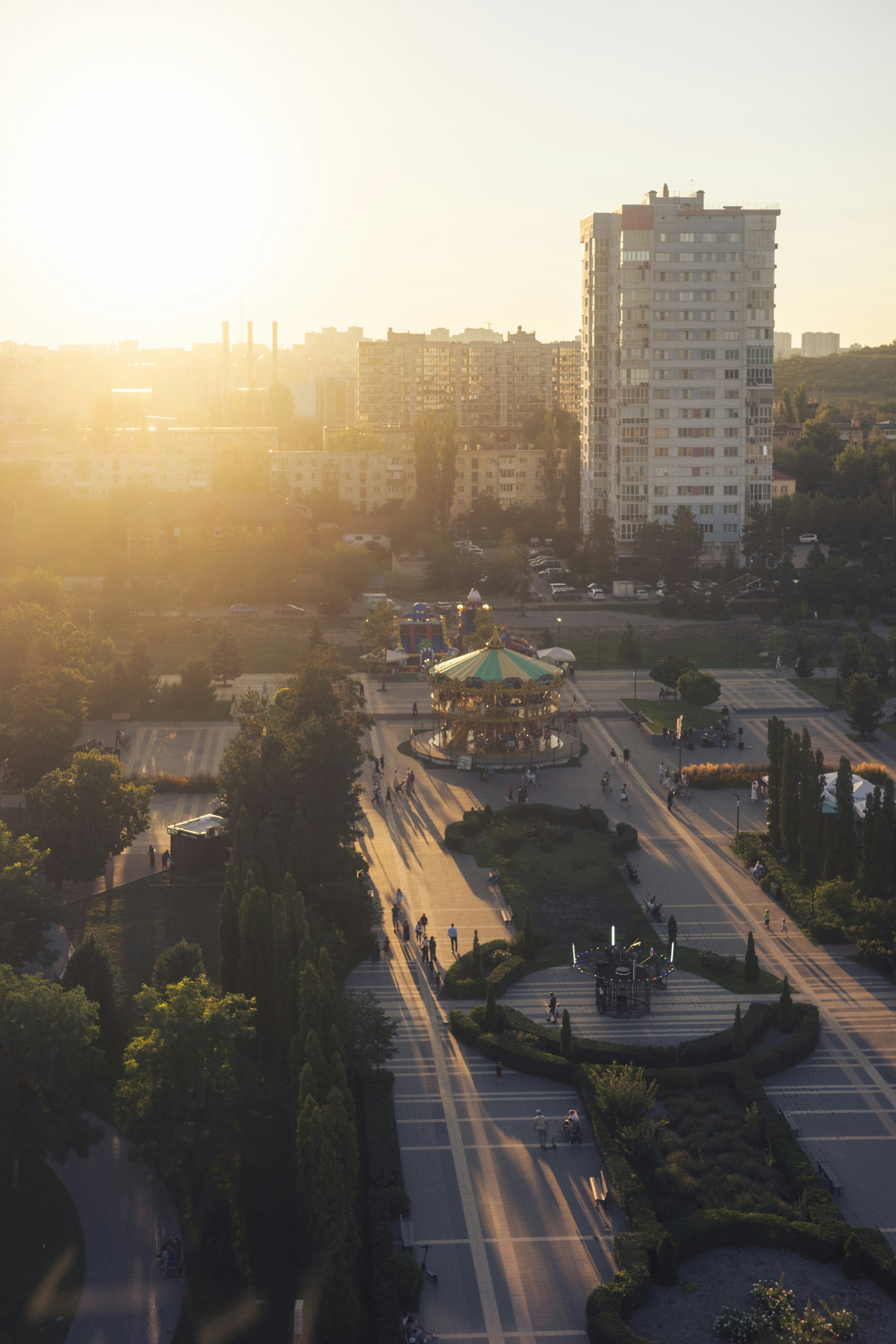 Amusement park with carousel at sunset