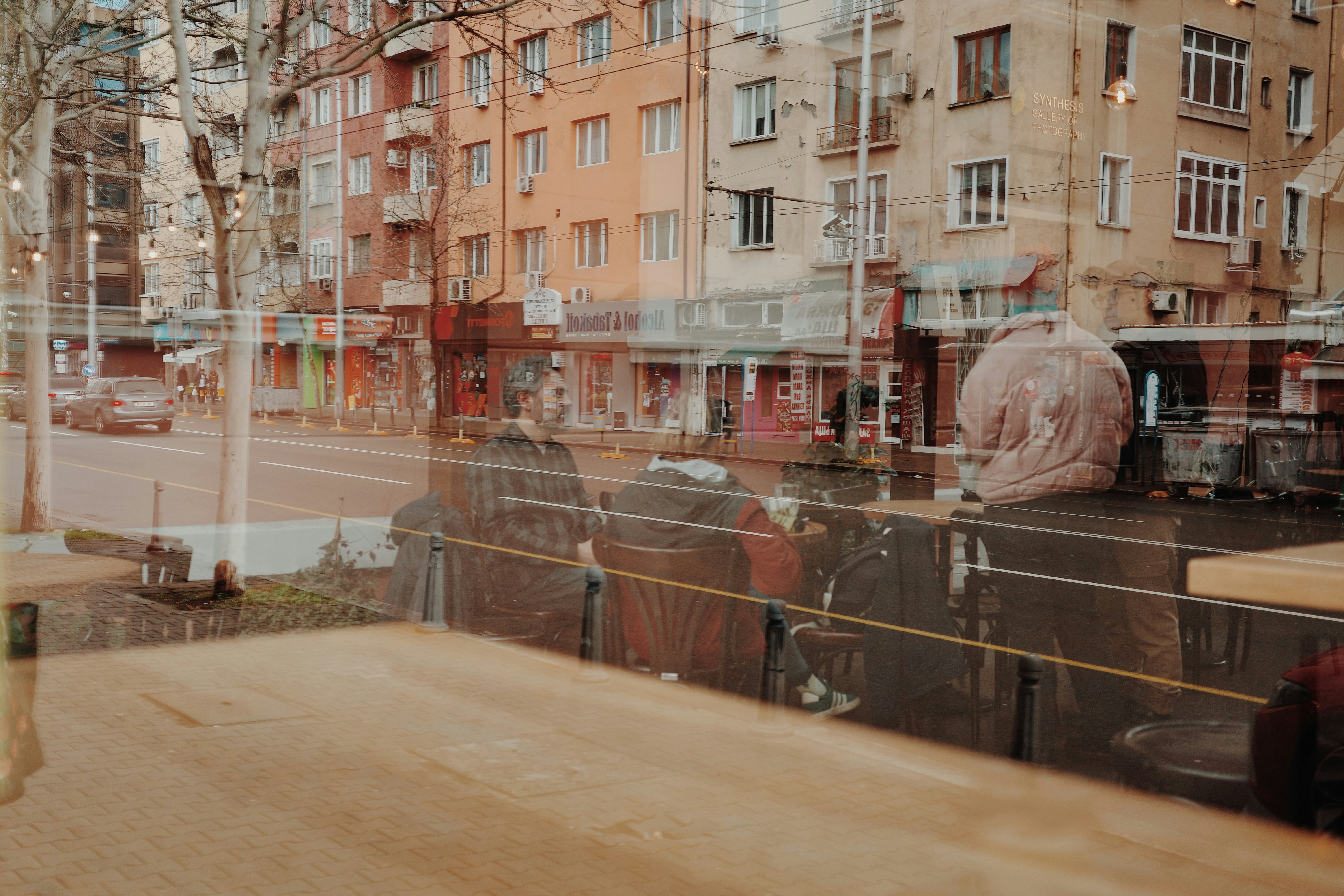 Reflection of city buildings in a shop window