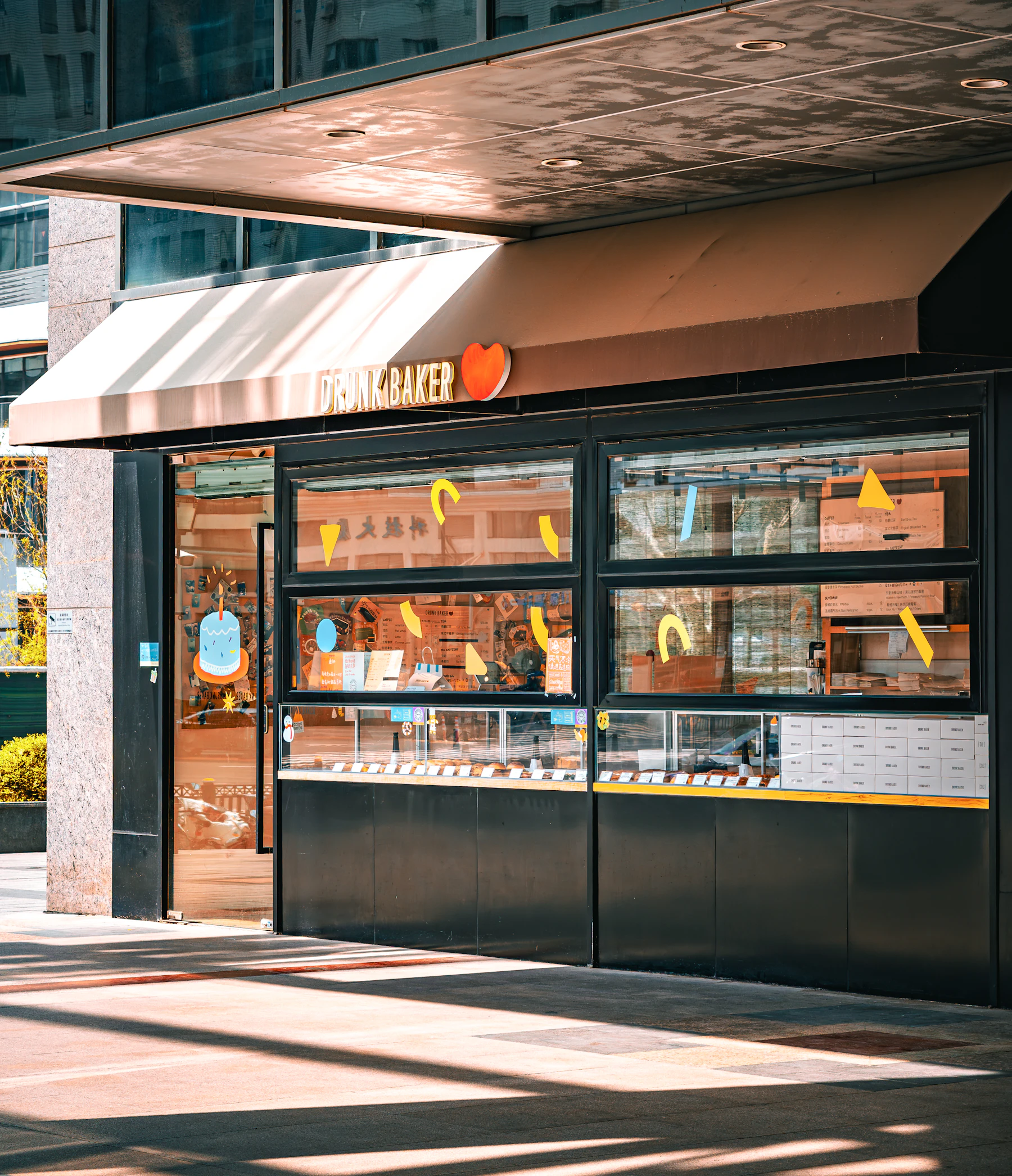 Le Four bakery storefront with warm morning light on the awning