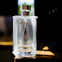Prada cologne bottle on a wooden surface