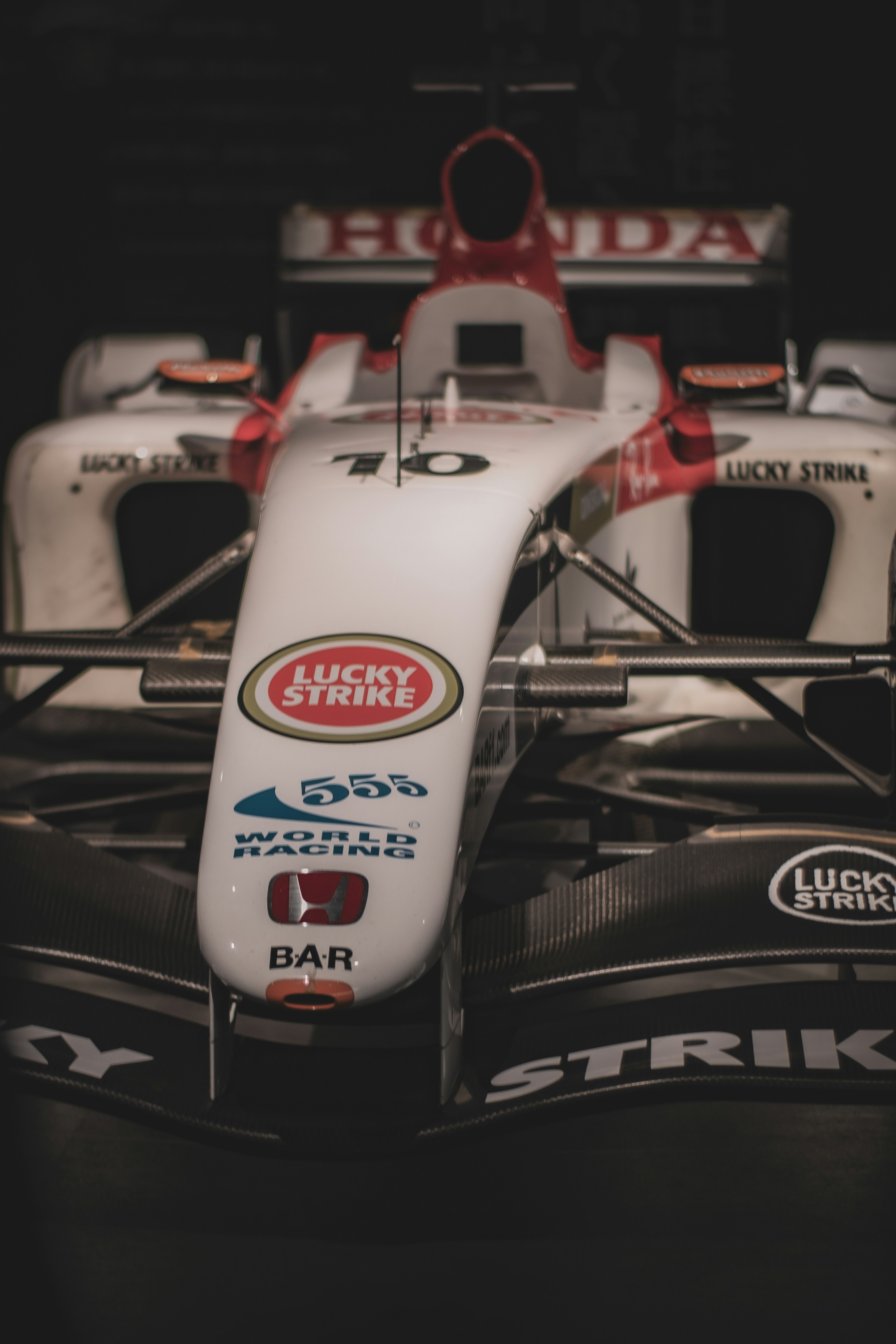 Front view of a white and red racing car.