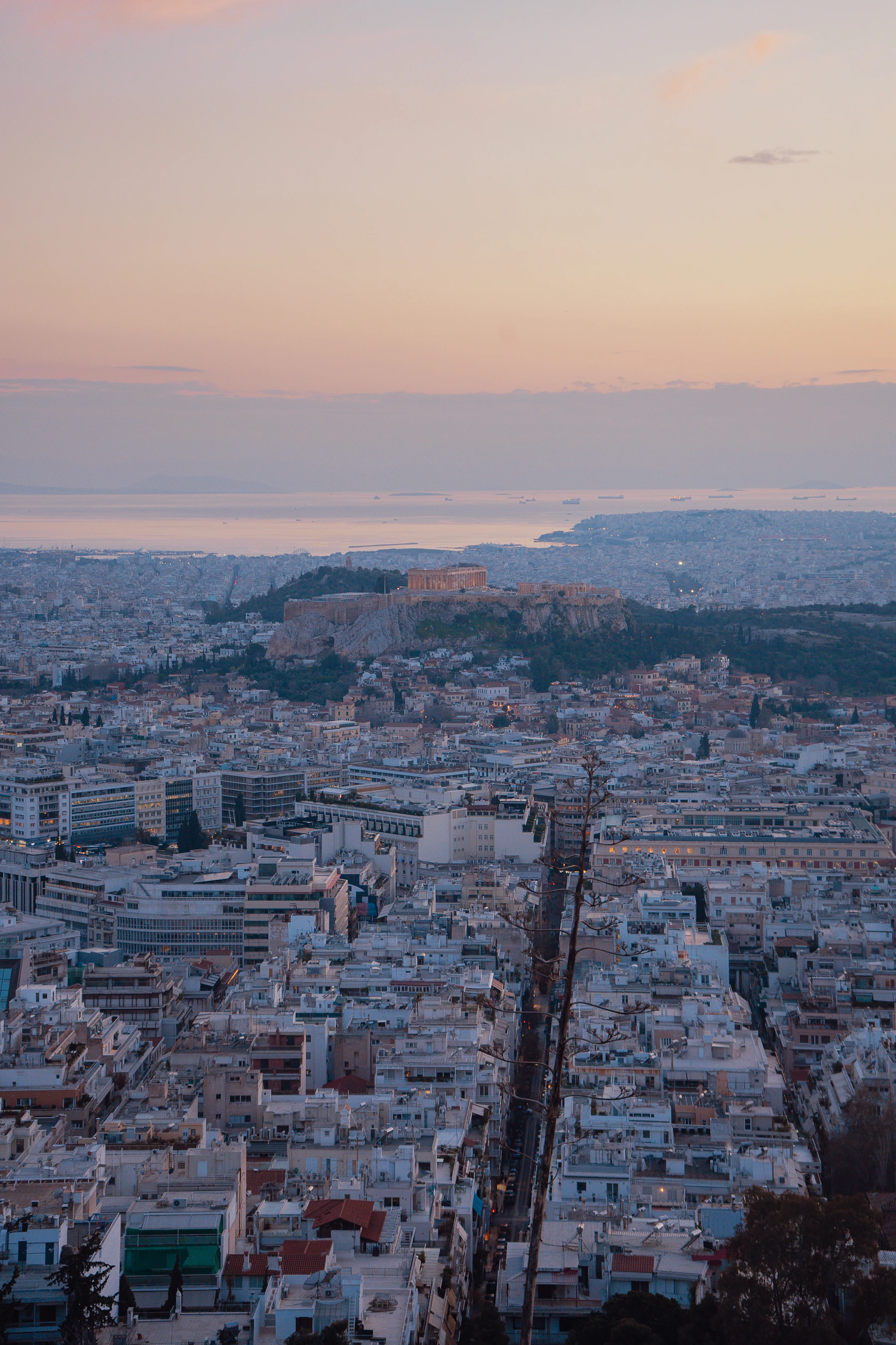 Athens spreading around the Acropolis in warm evening light