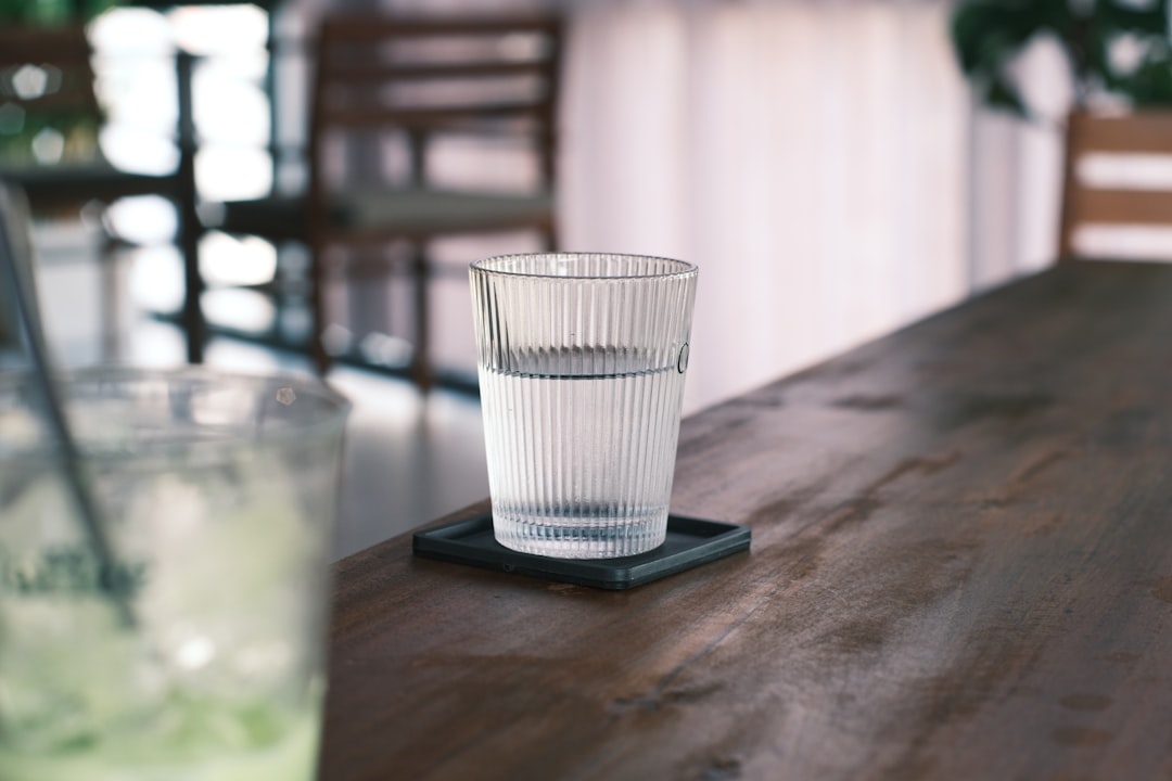 A glass of water on a wooden surface