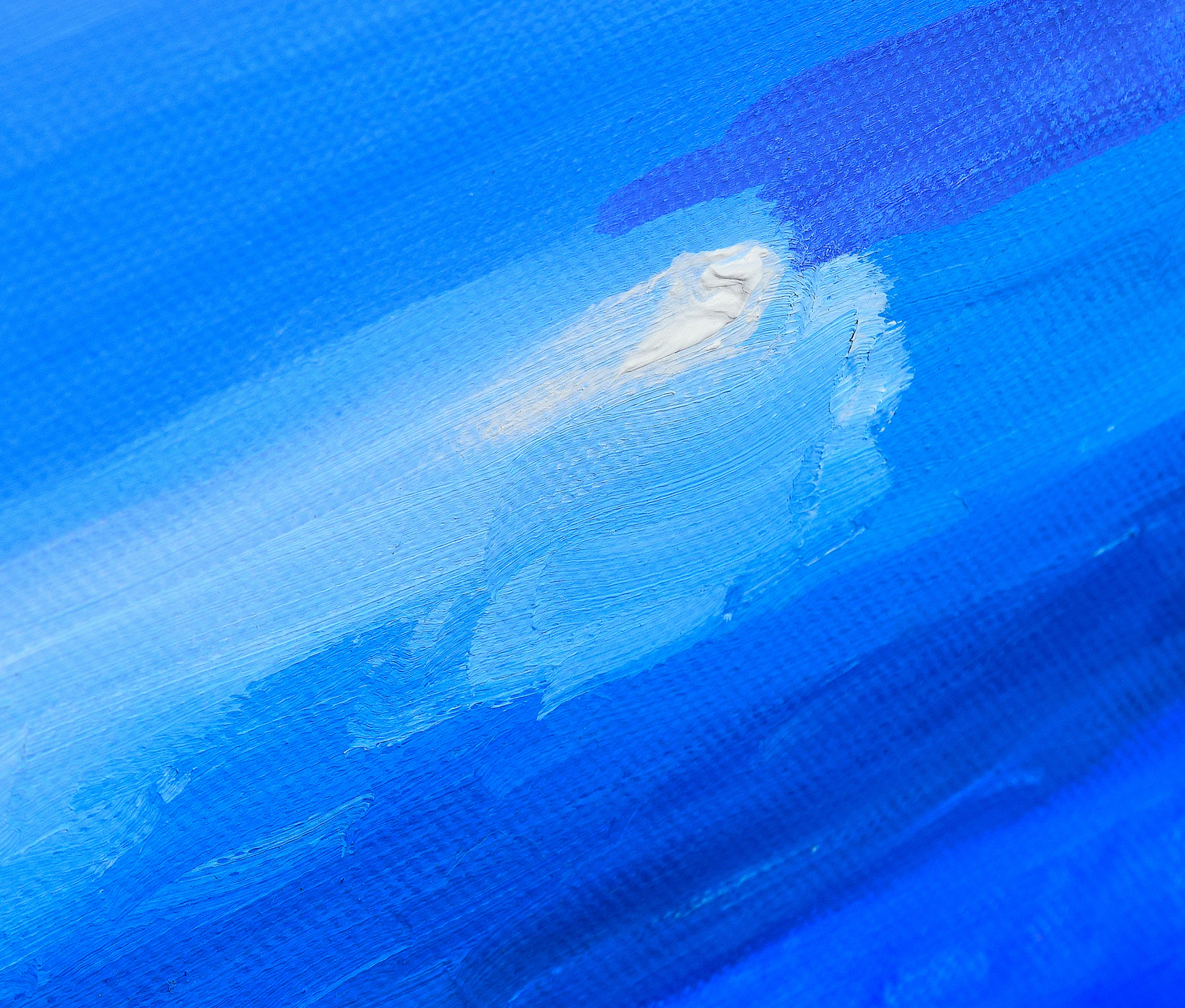 Abstract blue and white brush strokes on canvas