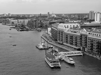 Boats docked along a river in a city