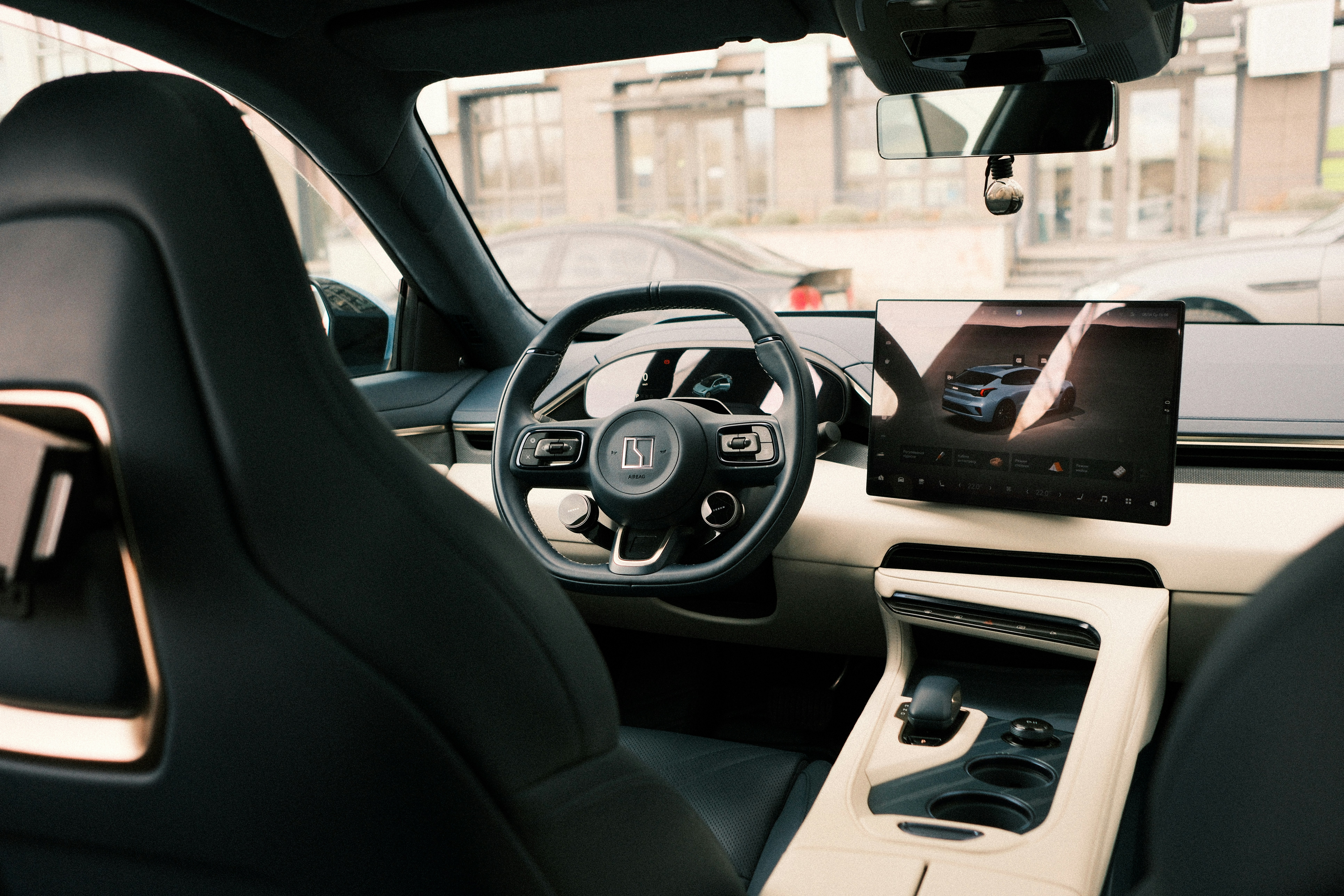Modern car interior with large touchscreen display.