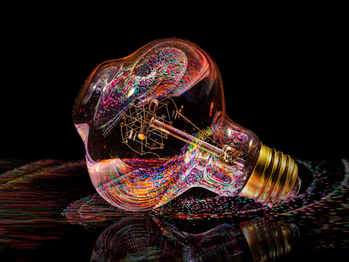 Abstract colorful light trails inside a light bulb