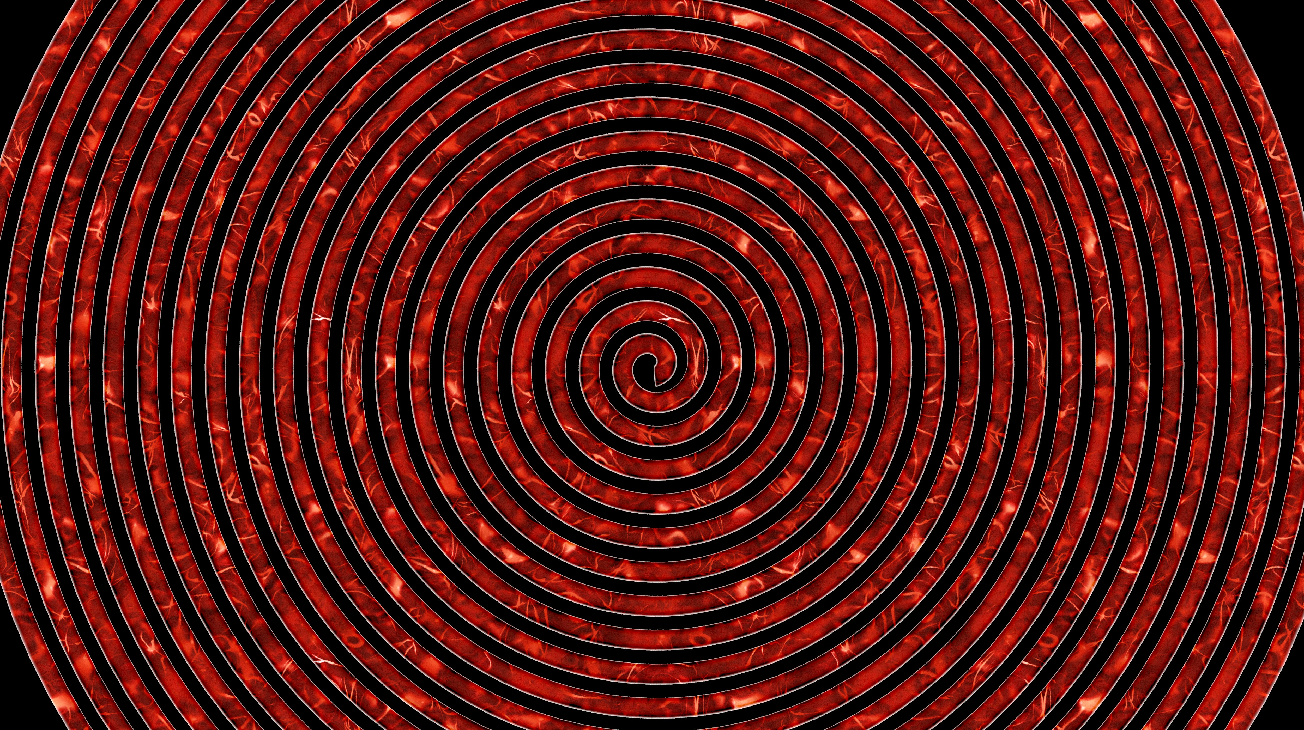 Motivo a spirale rossa su sfondo nero.