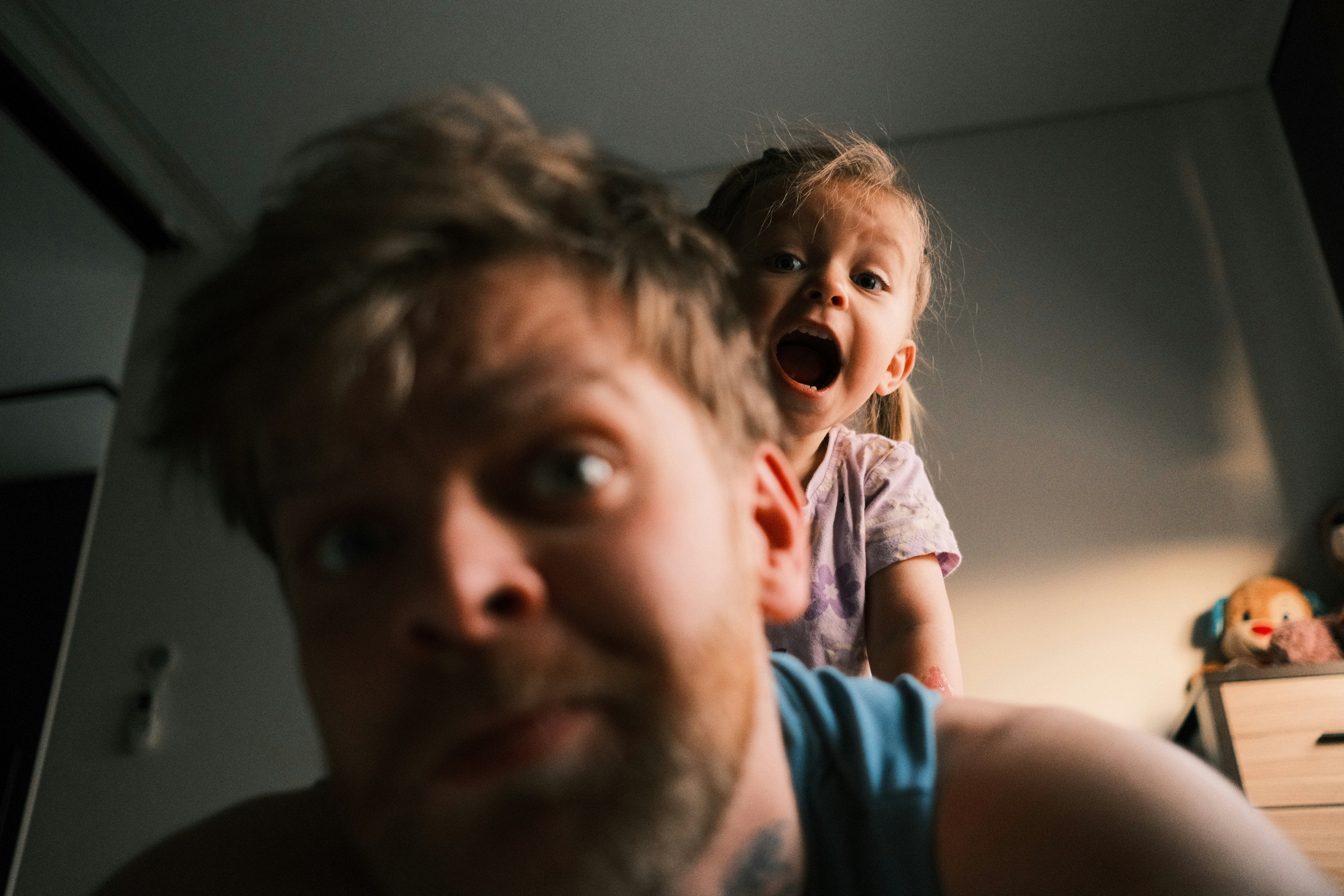 A father and daughter playing together