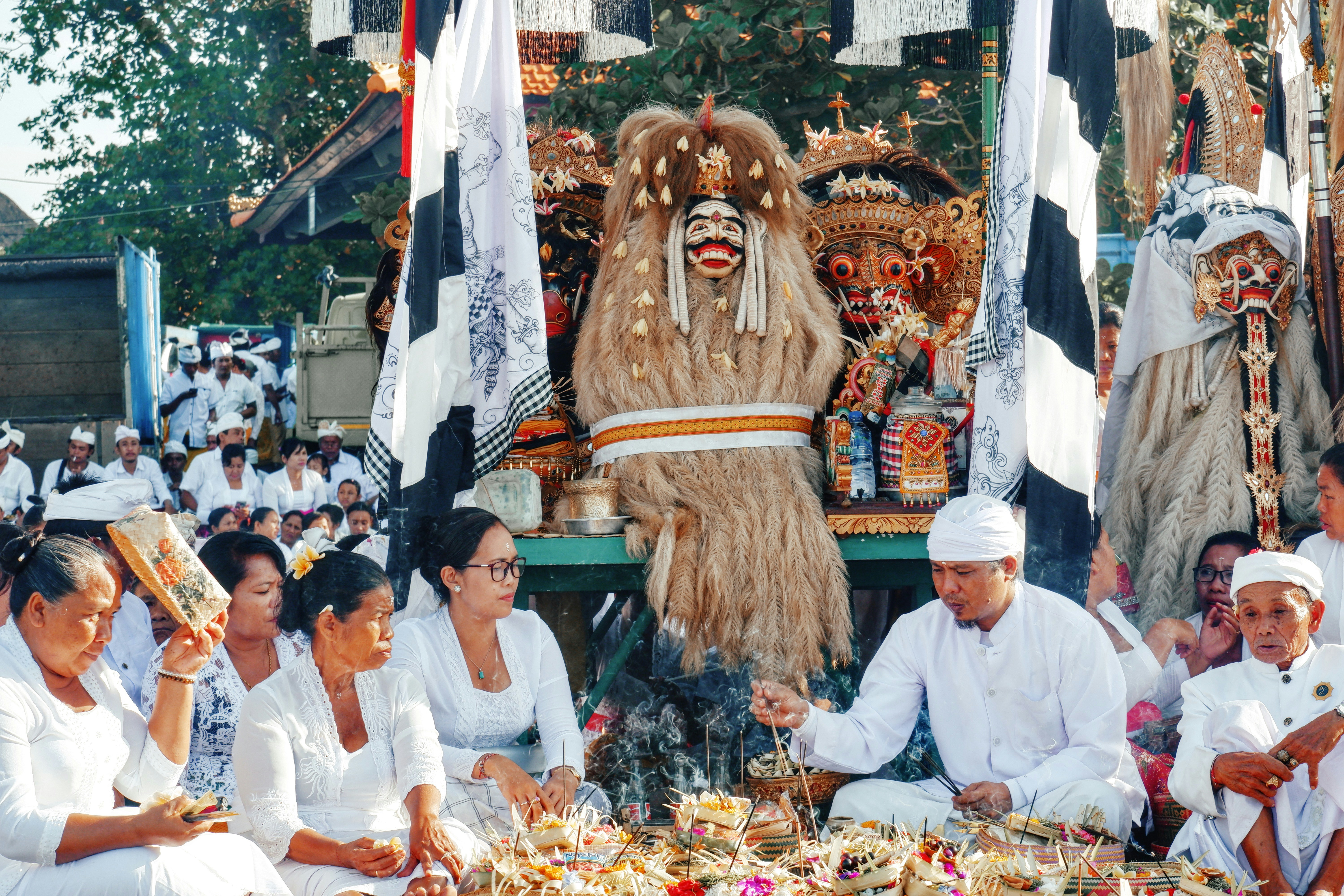 A documentary-style image capturing members of Desa Adat Abiansemal during the sacred Melasti purification ritual at Seseh Beach, Bali. Taken in 2020, this archival photograph reflects a deeply spiritual moment where the community gathers by the sea to cleanse sacred objects and themselves ahead of Nyepi. The image conveys raw emotion, tradition, and cultural continuity, with natural textures and candid composition emphasizing authenticity and heritage. Ideal for editorial, cultural, and historical storytelling.
