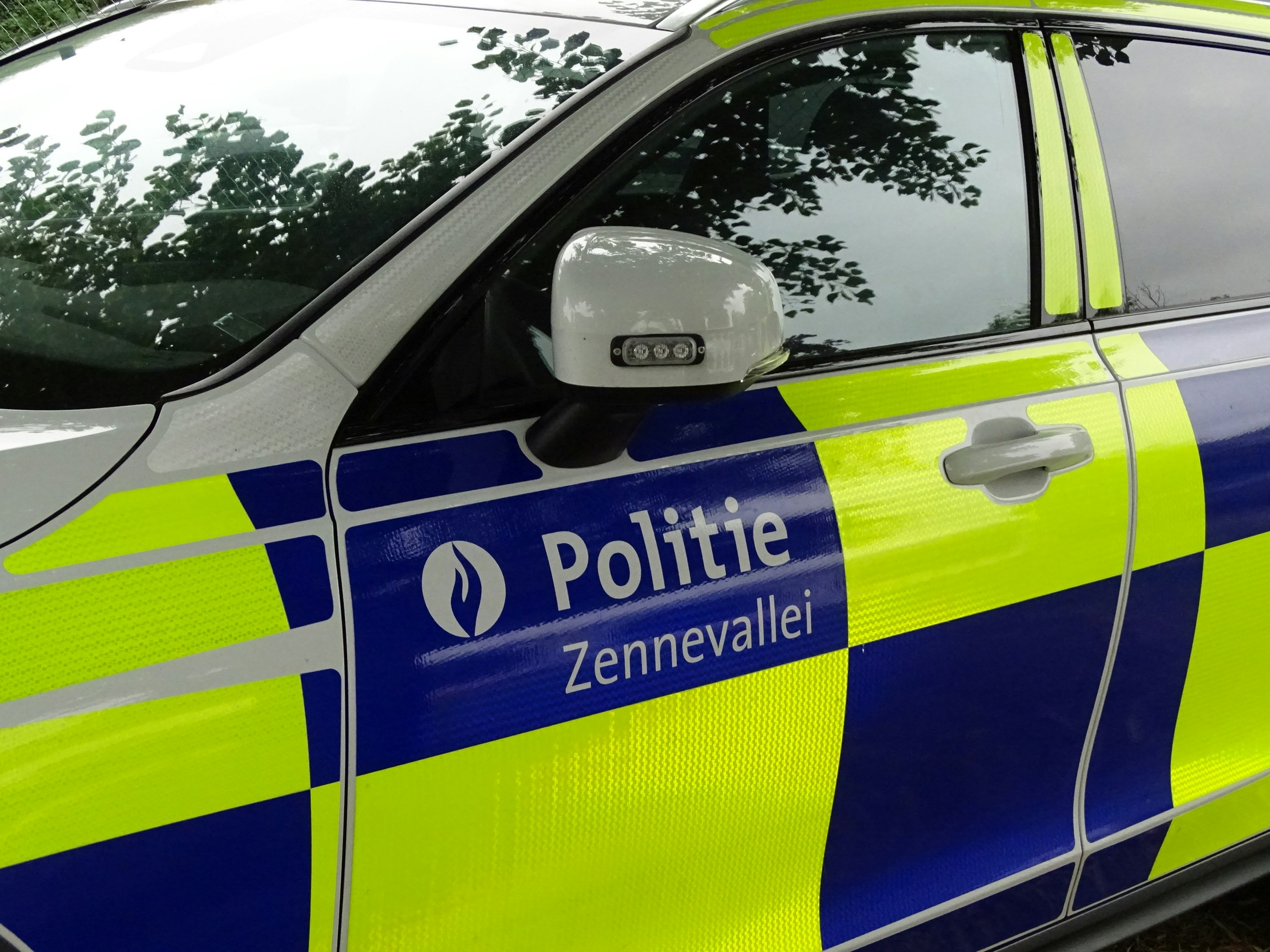 Police car with blue and yellow checkered pattern