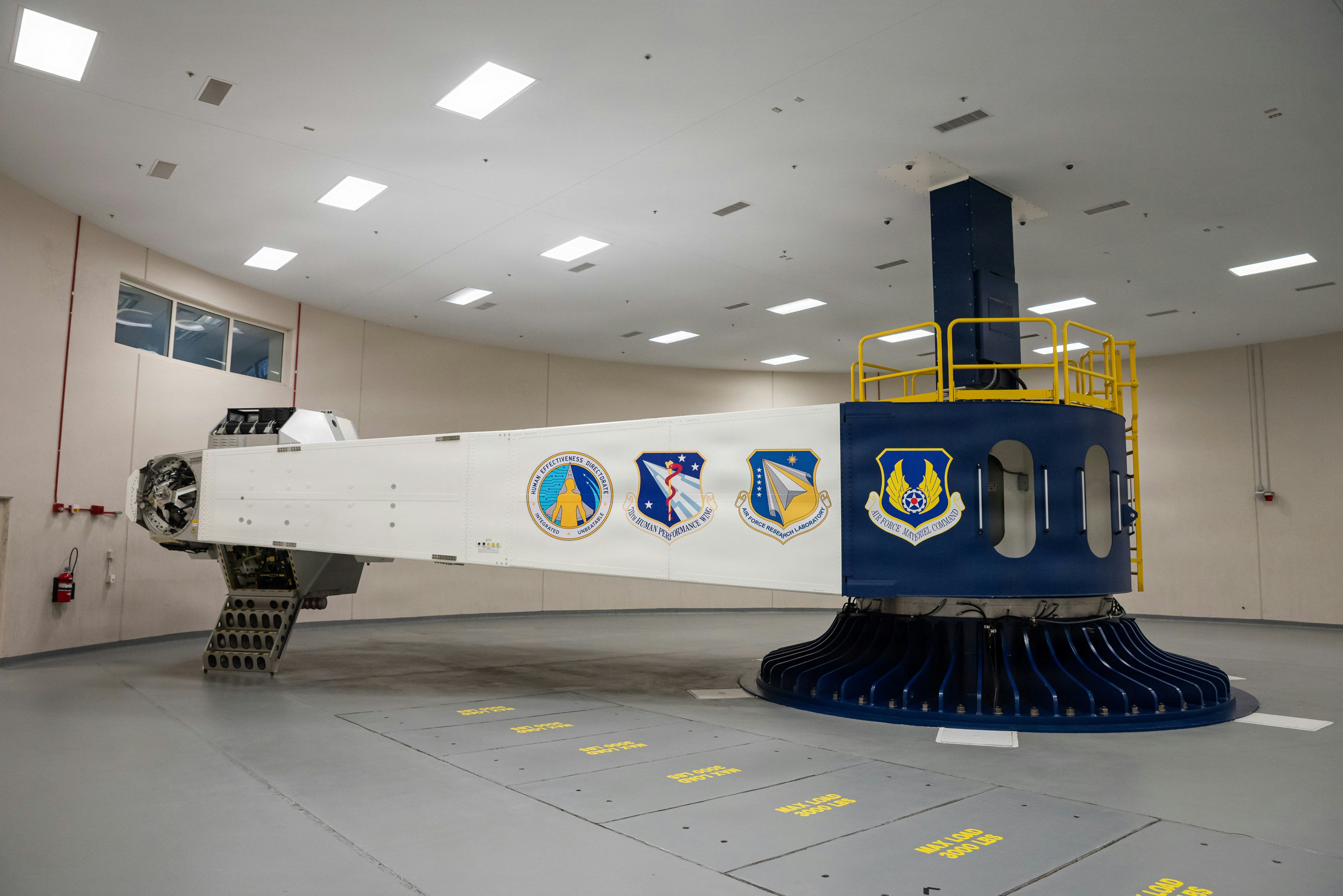Large white centrifuge with blue base and logos