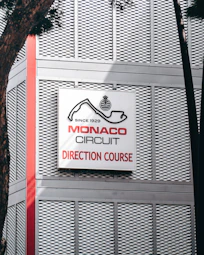 Monaco circuit direction course sign on building