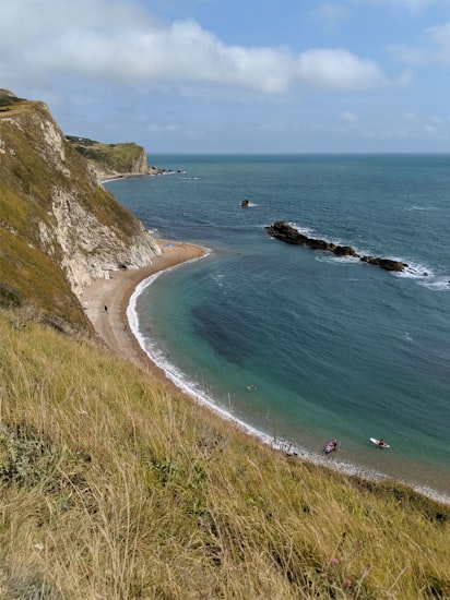 Enclosed cliff-ringed cove at Lusty Glaze, Newquay