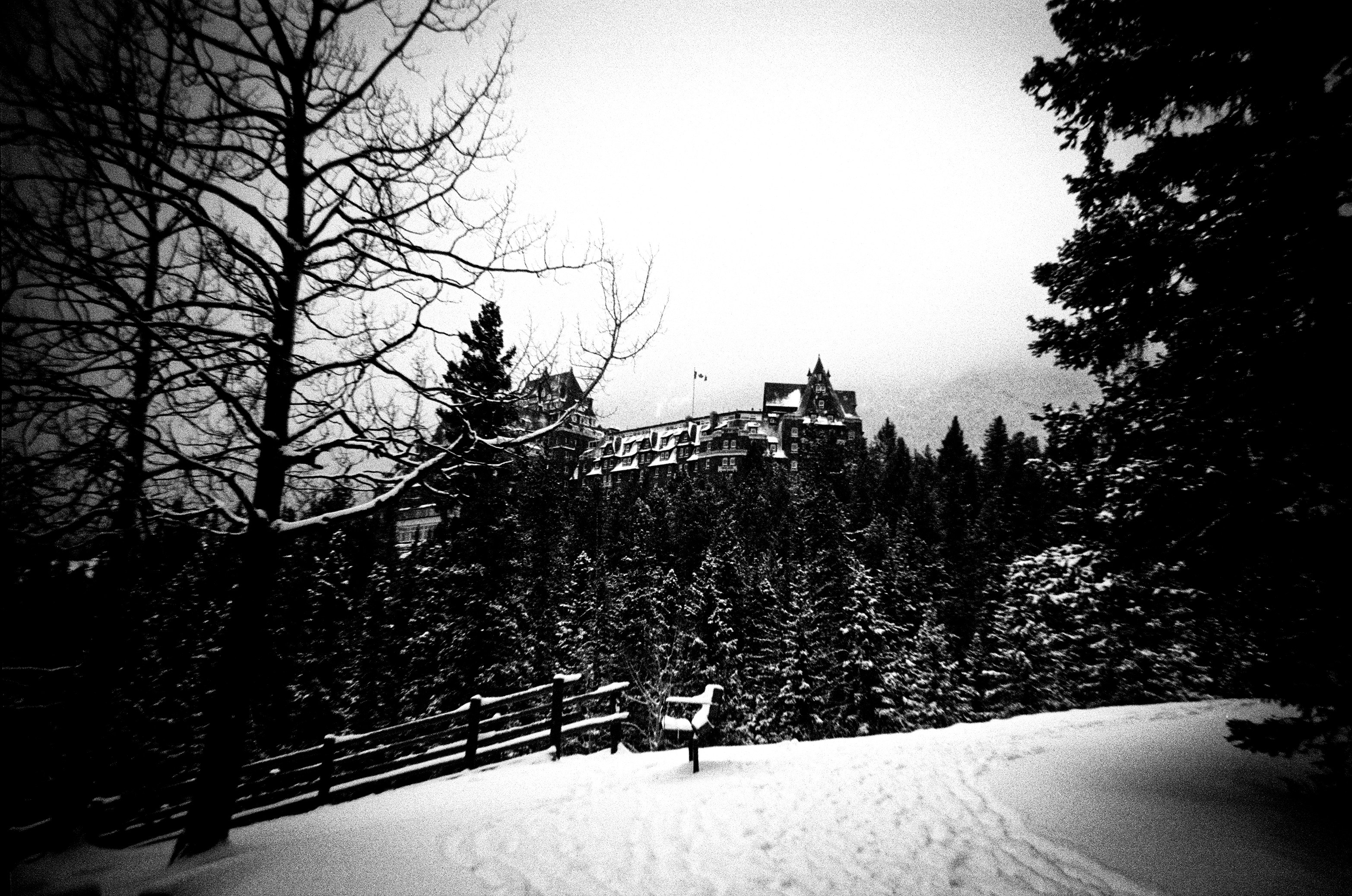 Snowy landscape with a building on a hill