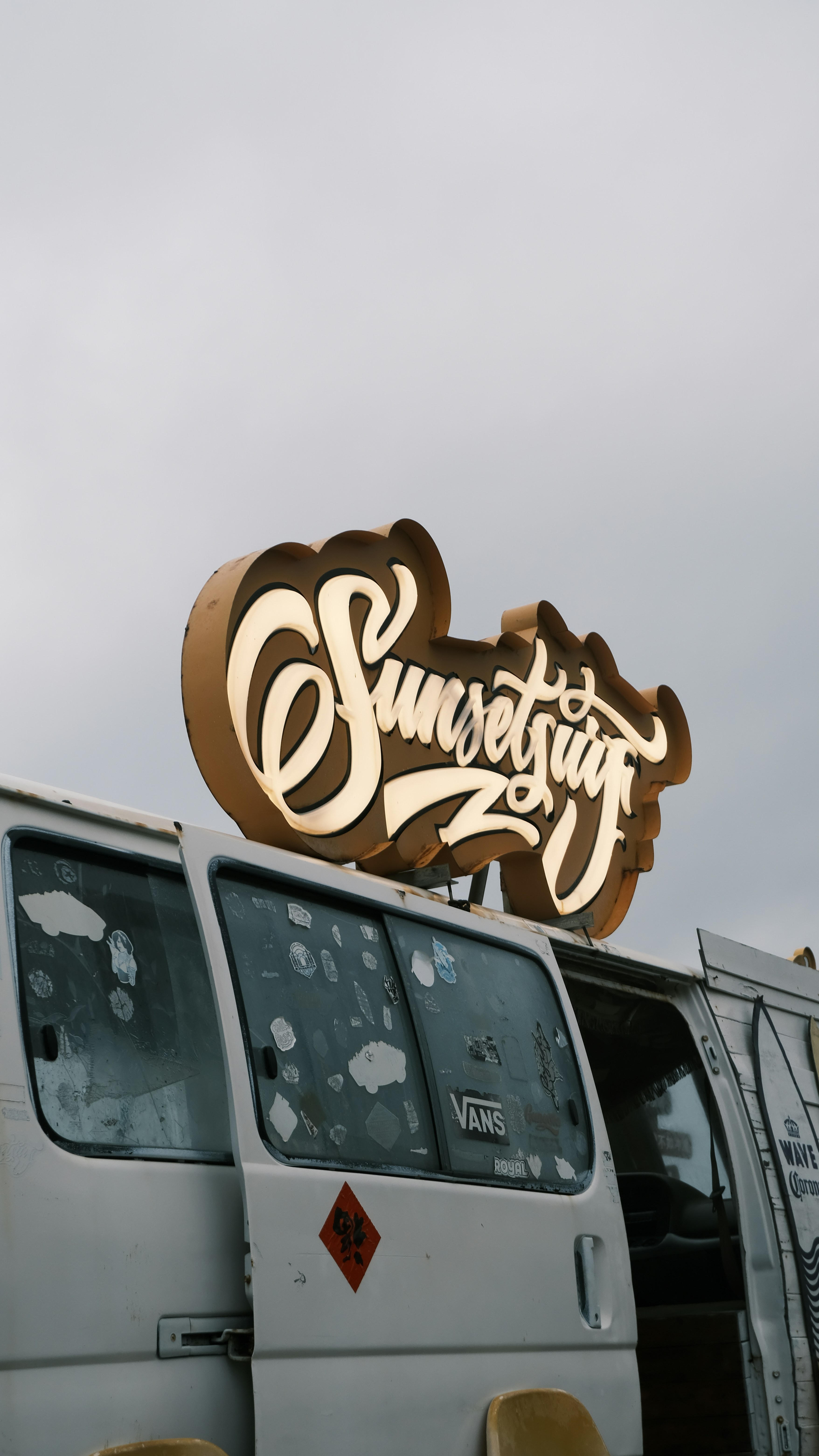 Close-up of vinyl graphics being applied to a vehicle panel