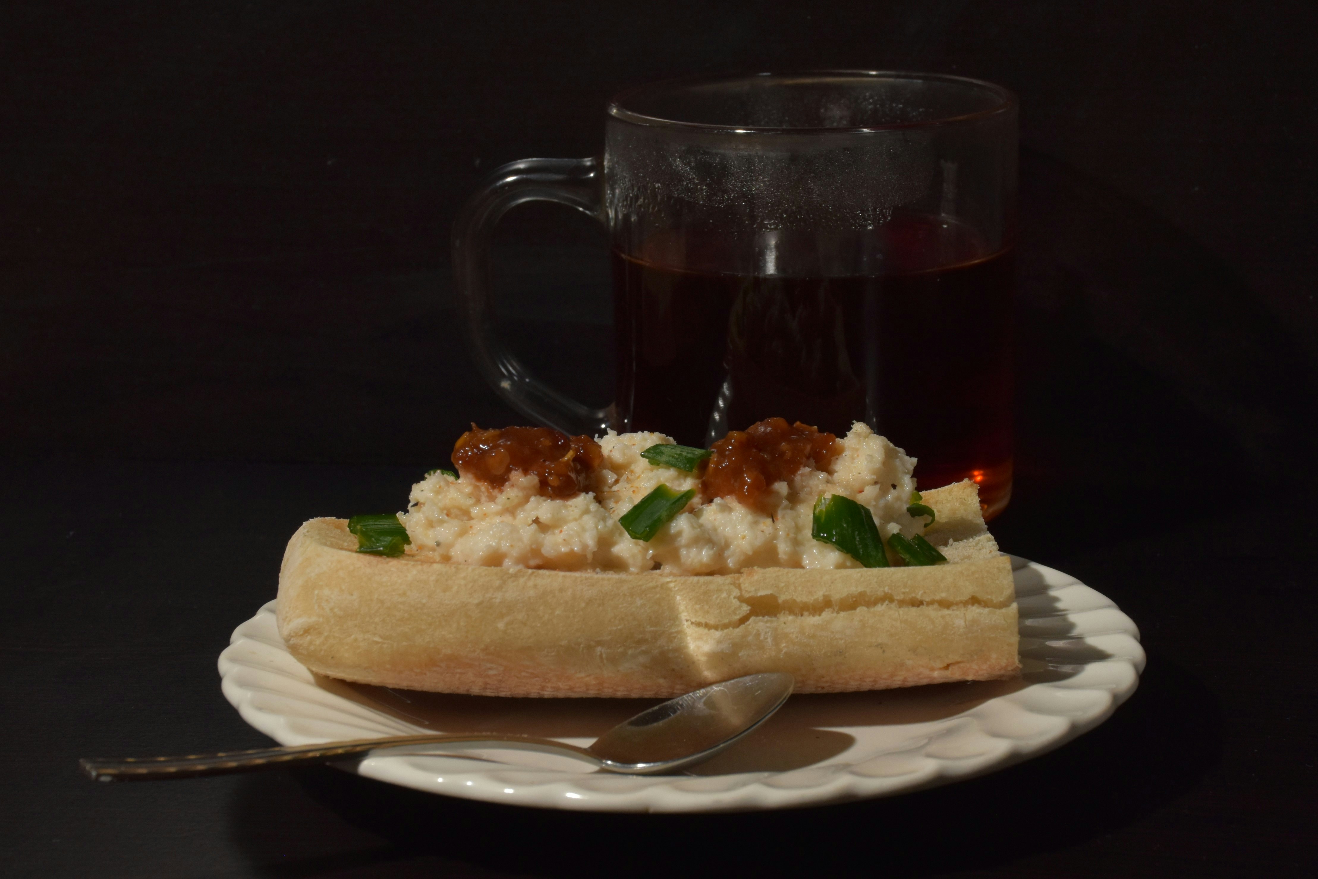 A pastry with toppings and a drink