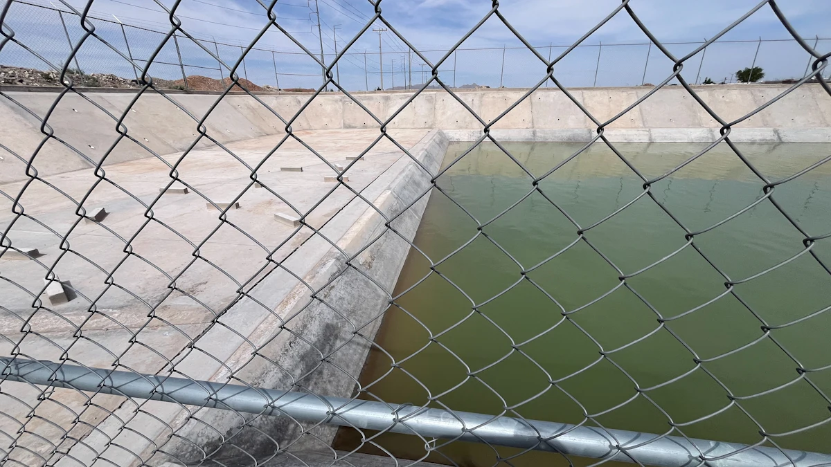 Concrete reservoir behind fence