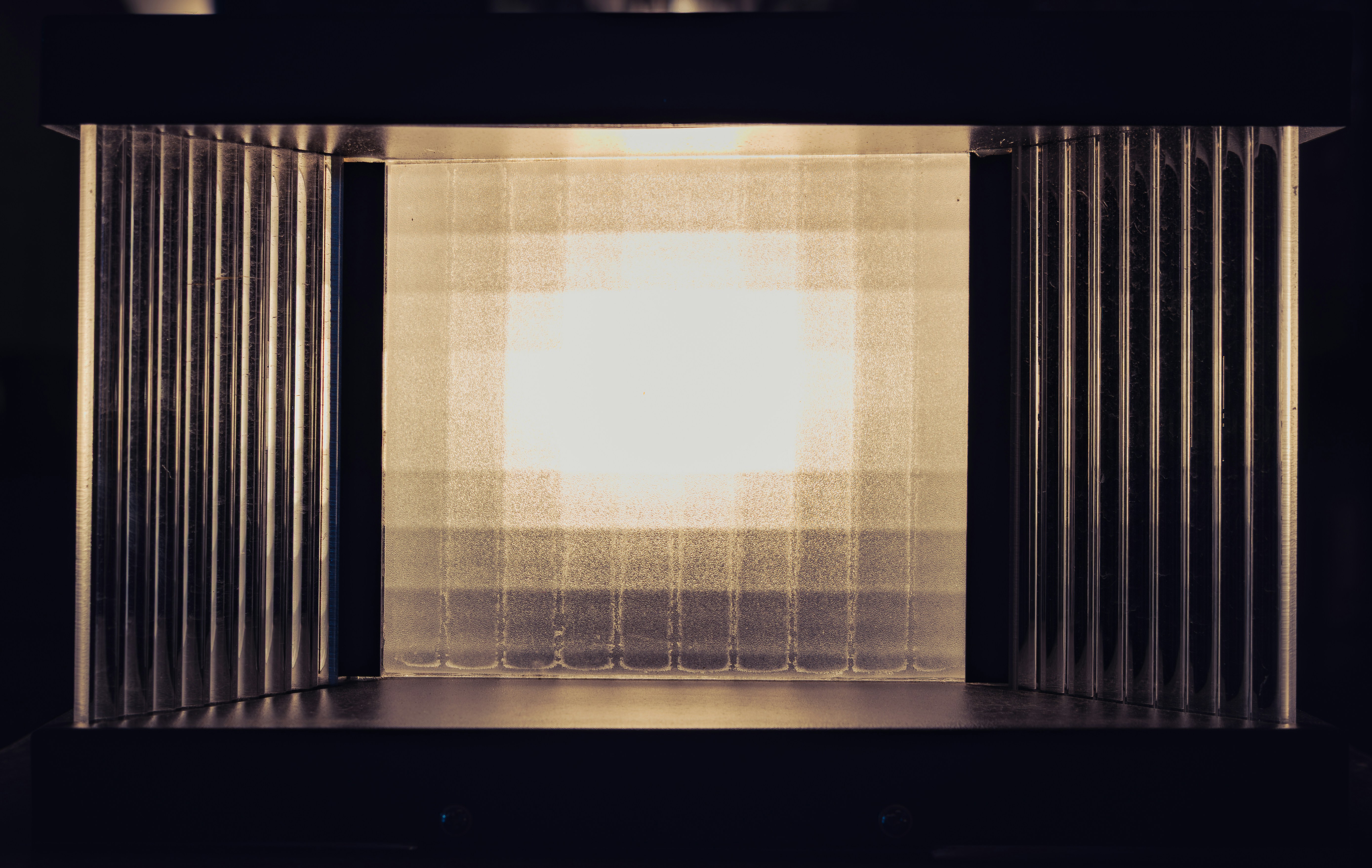 Geometric pattern with bright center and dark squares
