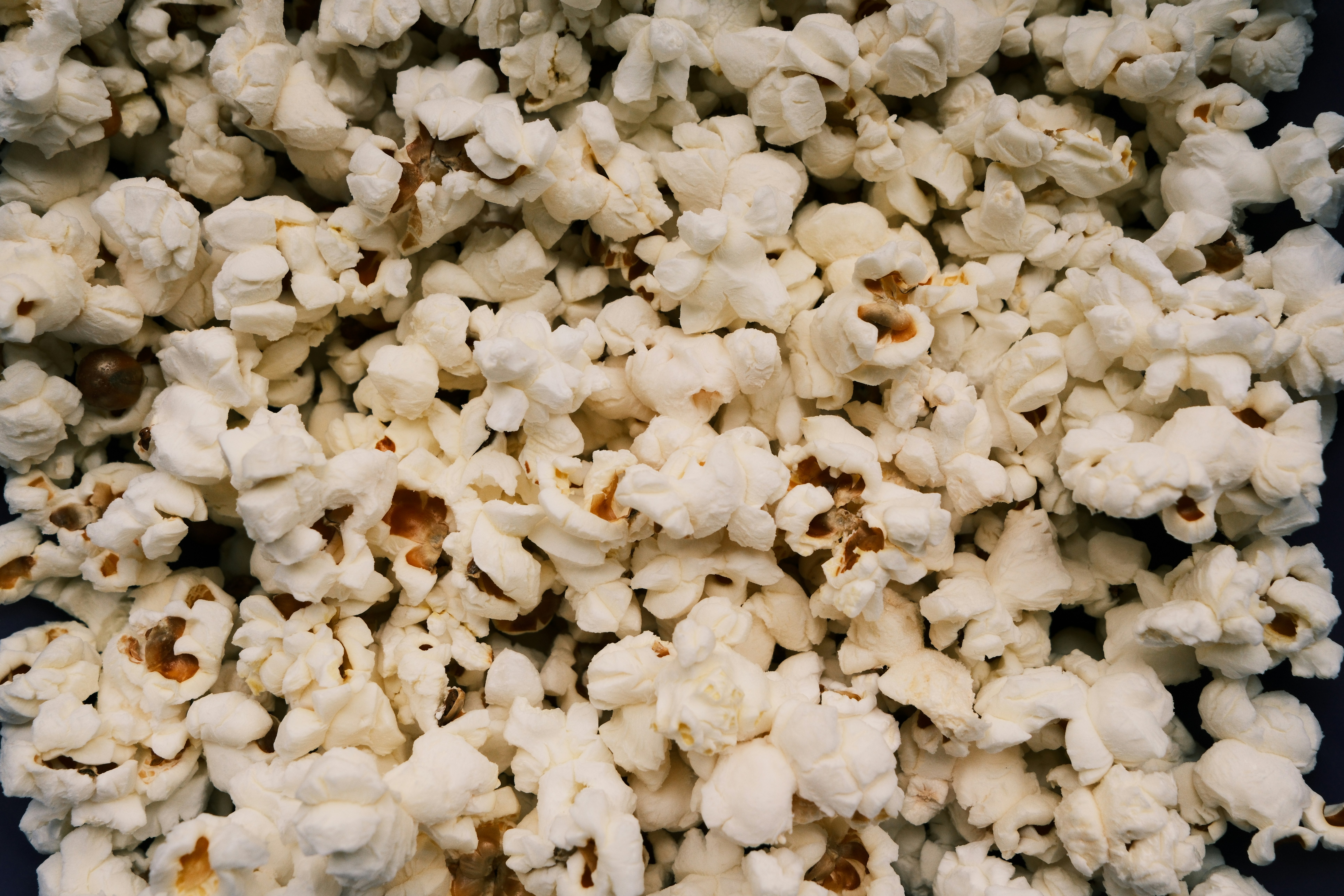 A close-up view of freshly popped popcorn.