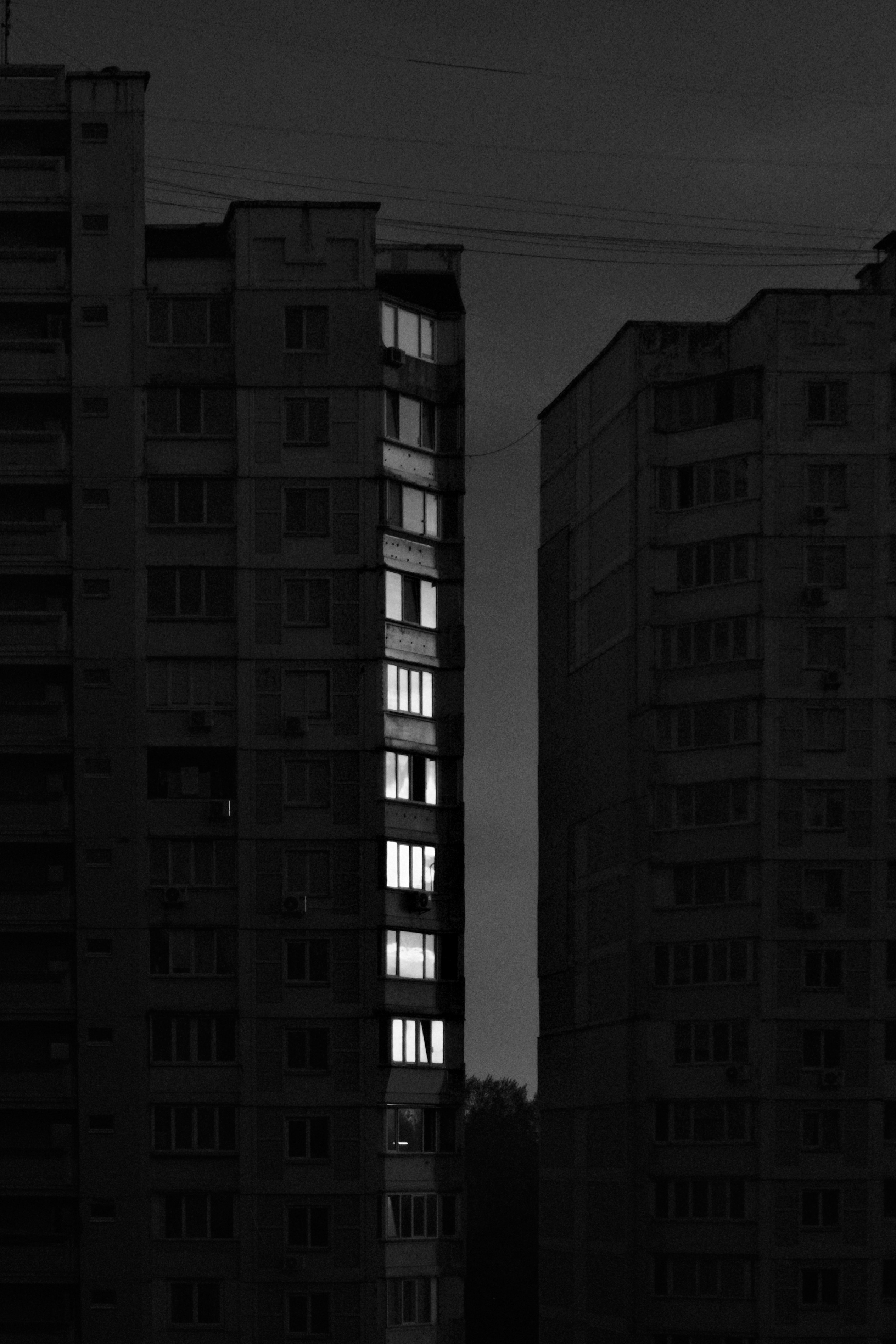 Apartment buildings with illuminated windows at night
