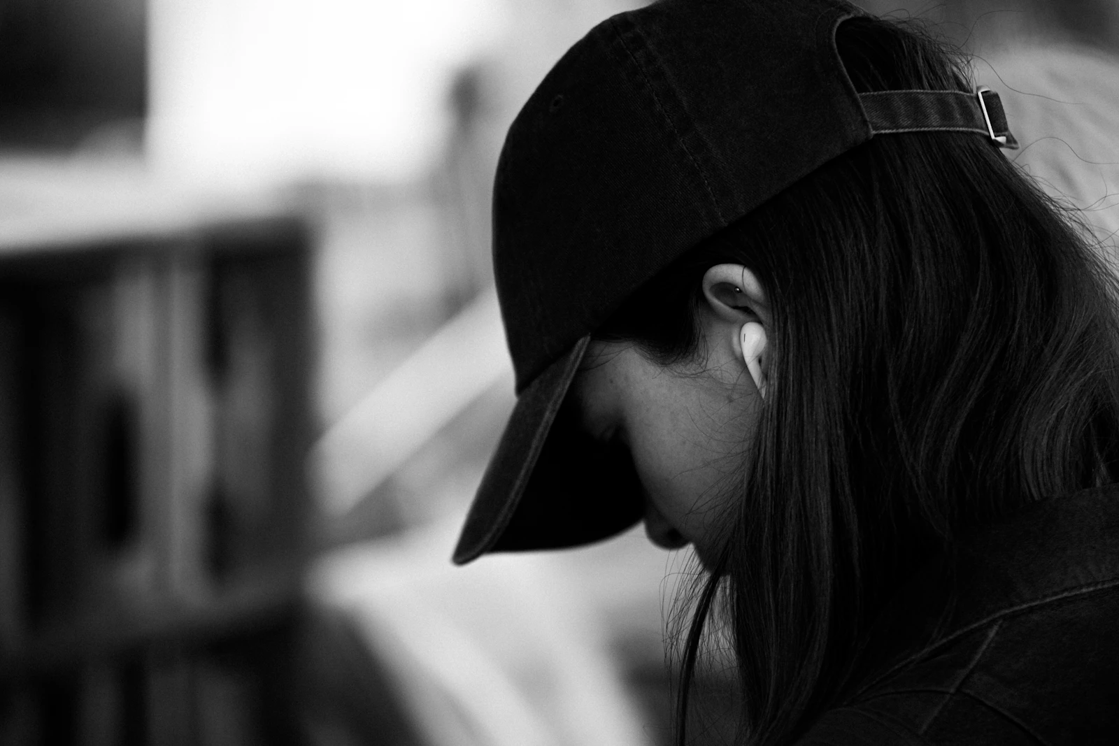 A person wearing a structured baseball cap, illustrating custom headwear for brands