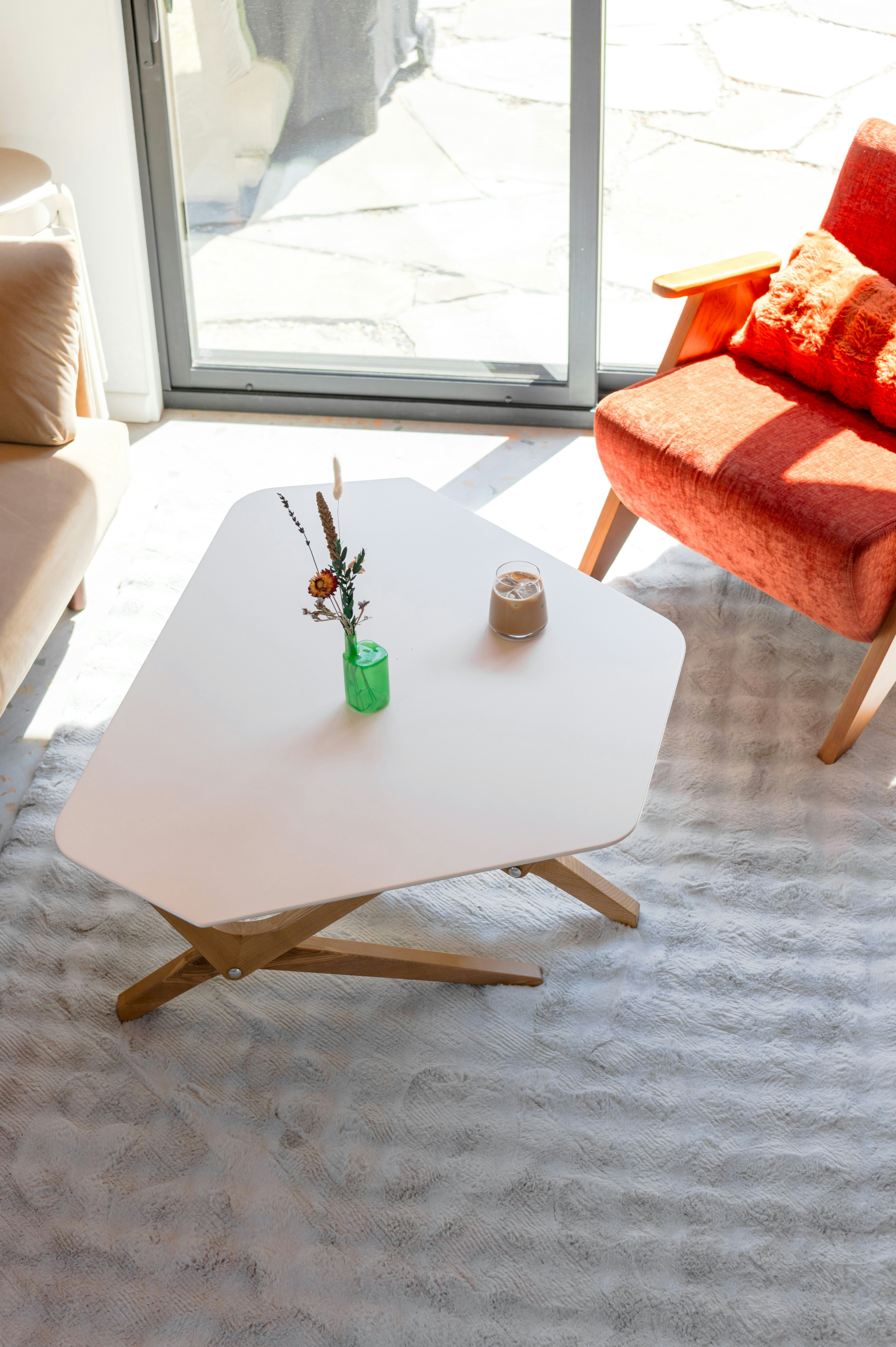 A white coffee table with decor in a living room.