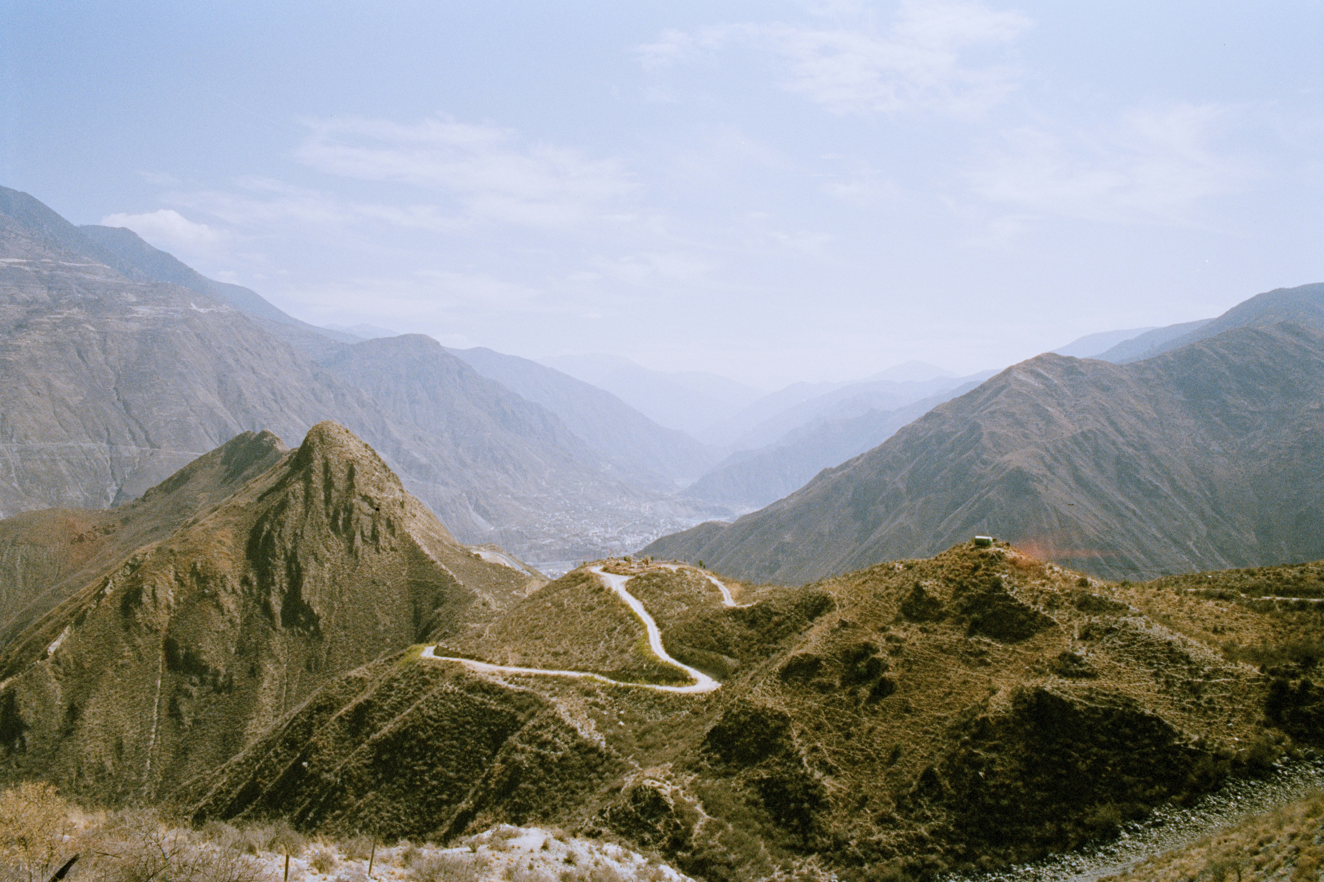 Winding road through rugged mountain landscape - Free Photo on Unsplash