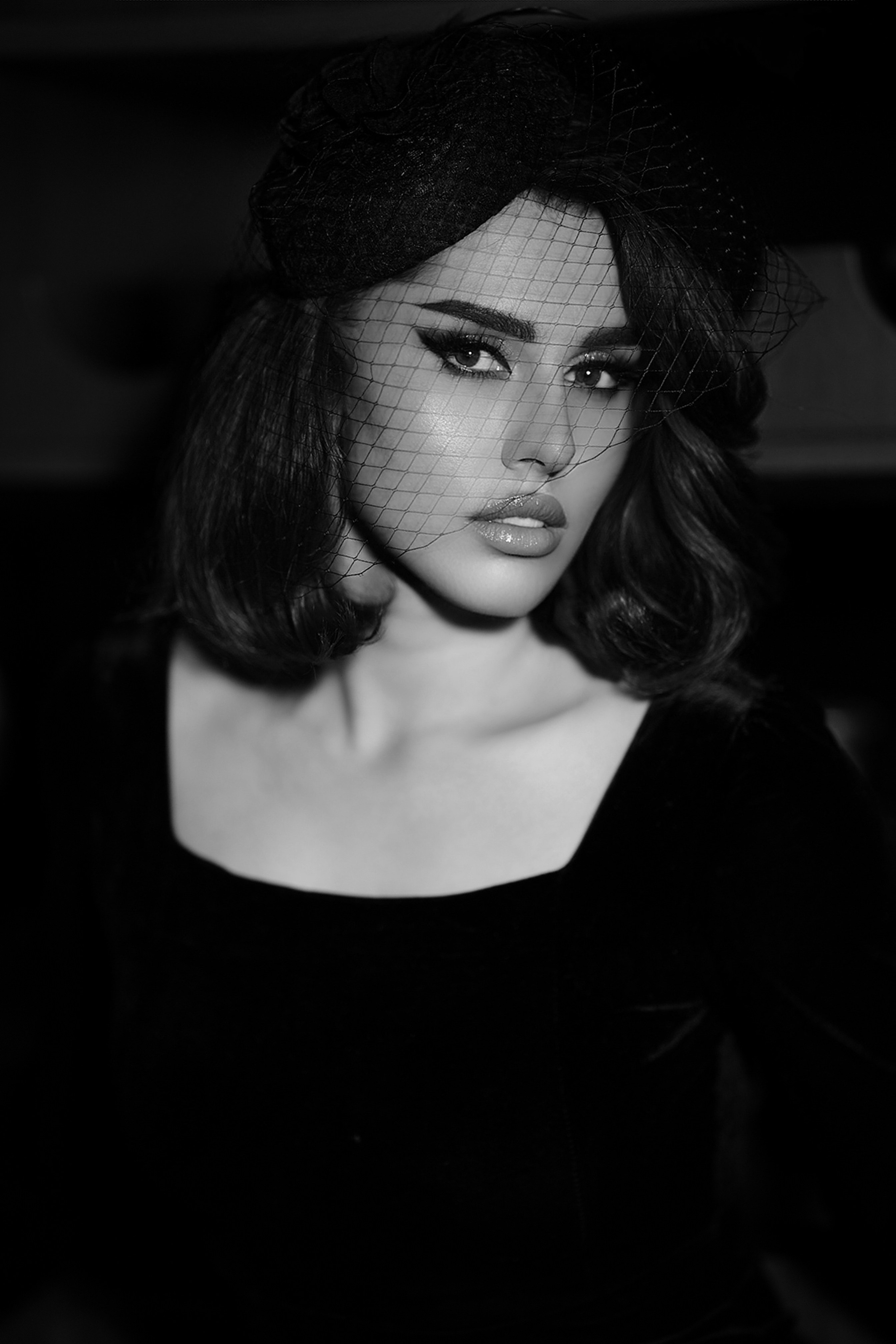 Elegant woman in vintage hat and velvet dress