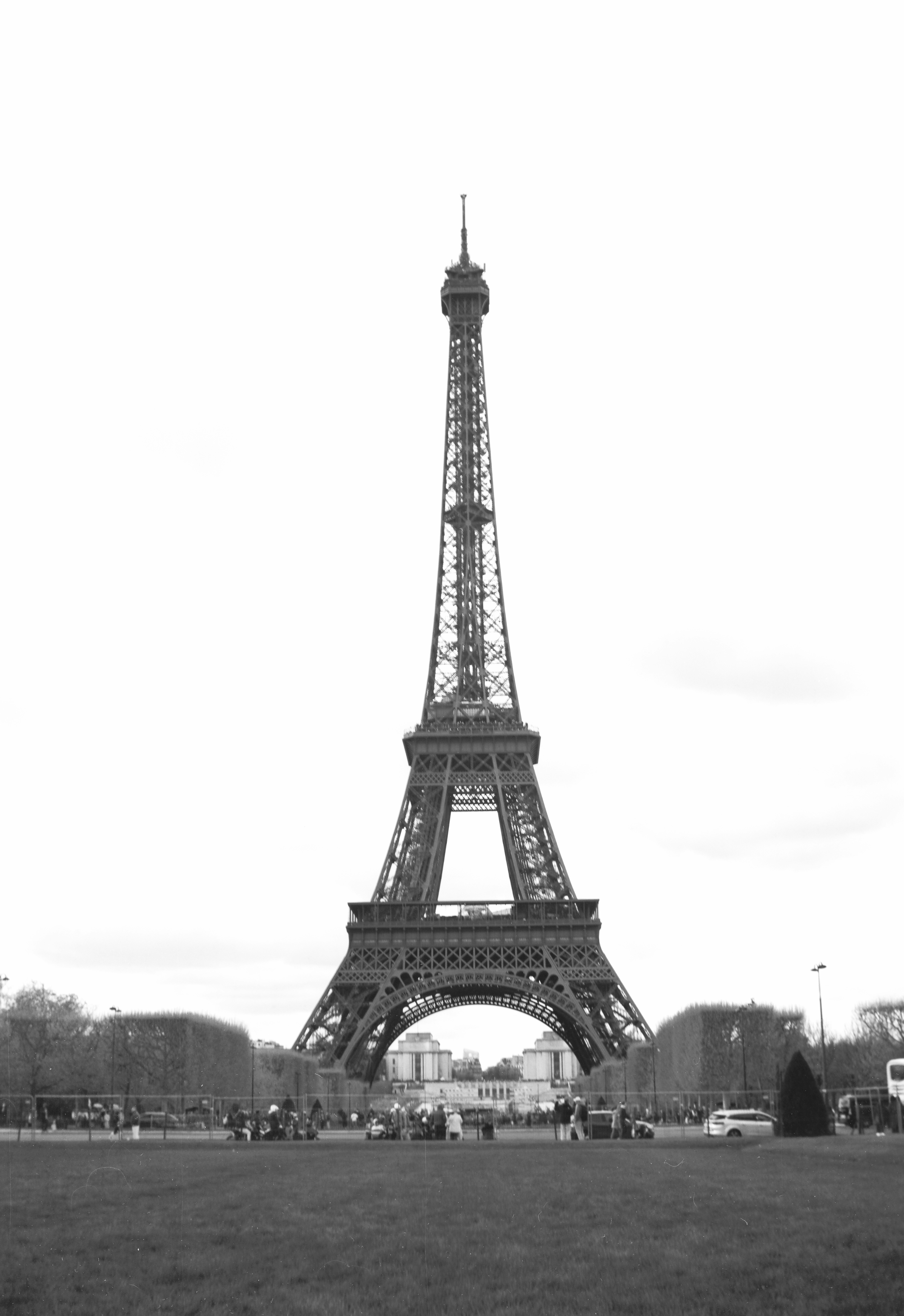 The eiffel tower stands tall against a bright sky.
