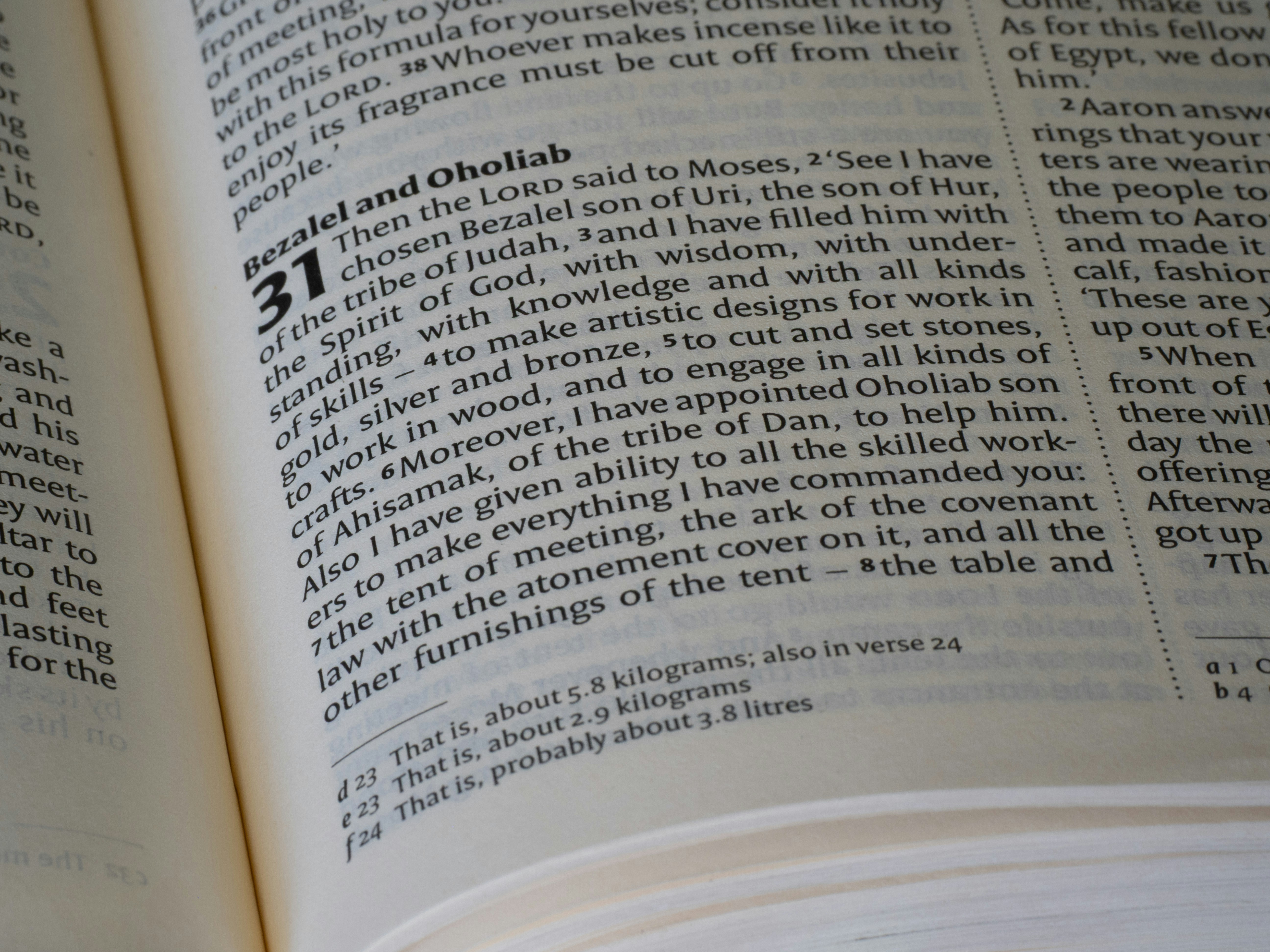 Close-up of an open book with text on pages.